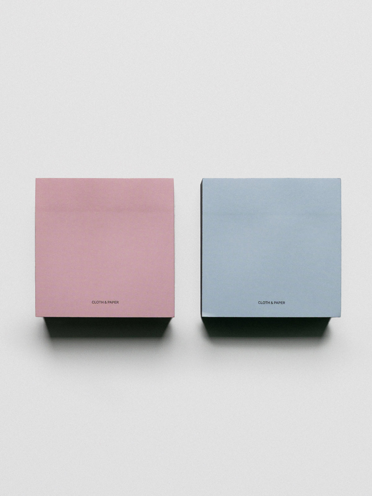 Colorblock Sticky Note Set in pink/red and blue/navy shown side by side.