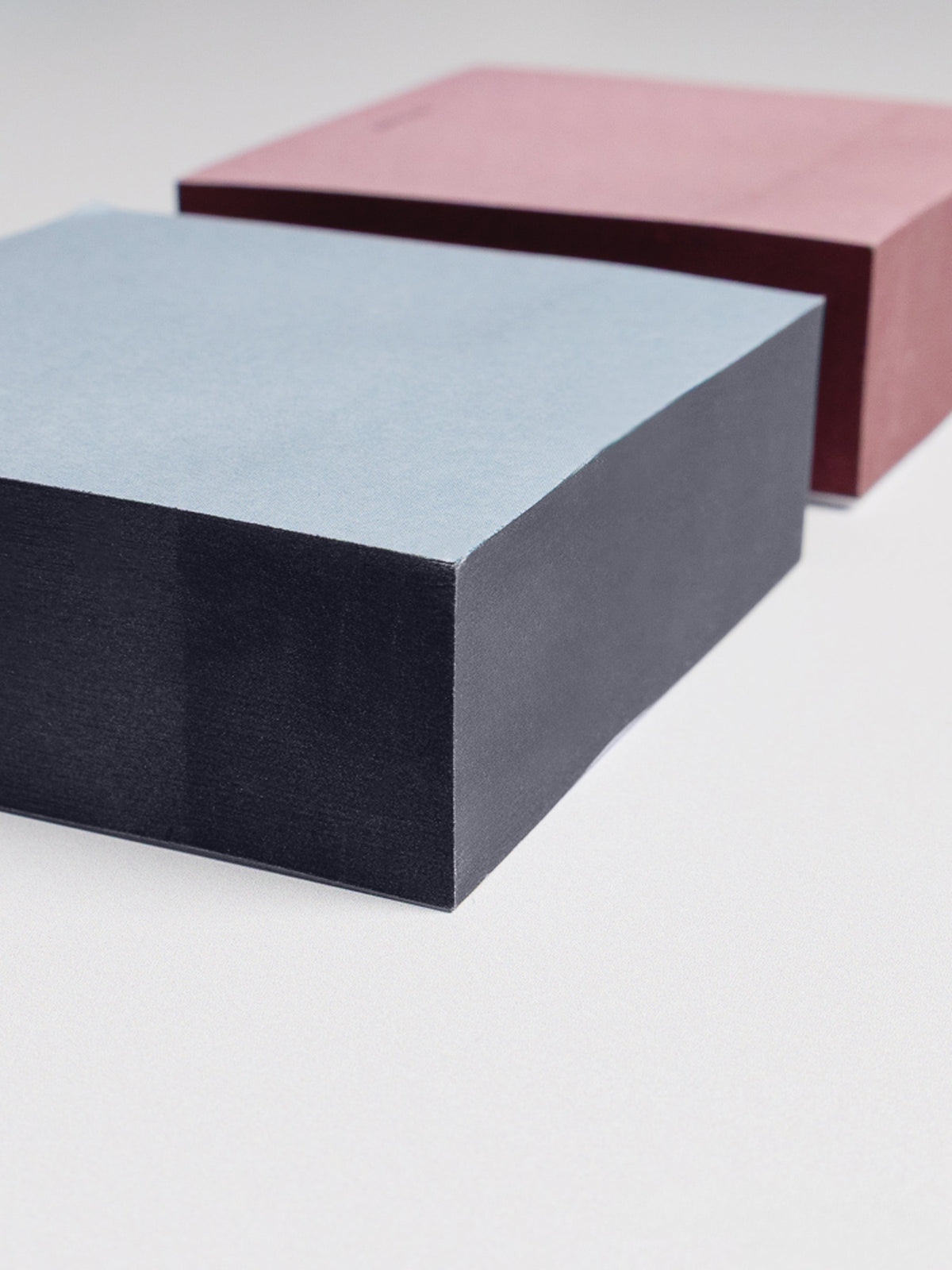 Close up view at an angle of Colorblock Sticky Note Set displaying the darker toned edge paint on each set.