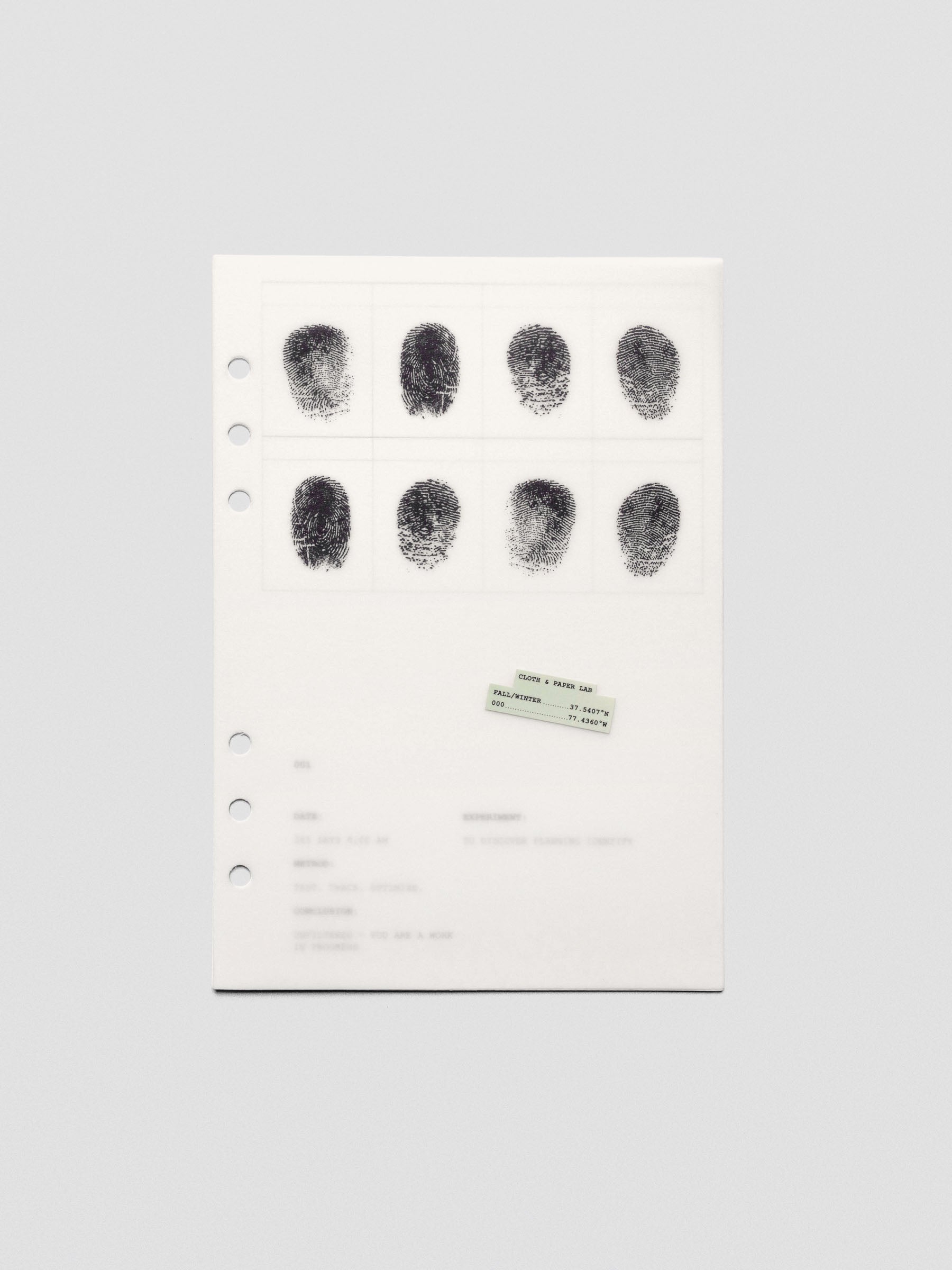 Two layered A5 sized planner dashboards, one semi-transparent, one matte, featuring a fingerprint design.