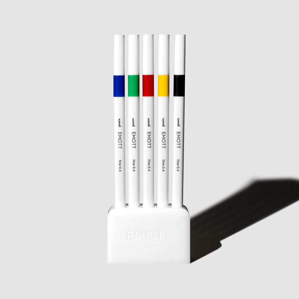 Uni Emott Fineline Marker Pens, 5 Color Set, Vivid. Uni Emott fineliners displayed with their case on a neutral background.