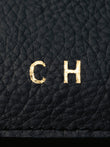 Close up example of gold foil debossing with the initials CH.