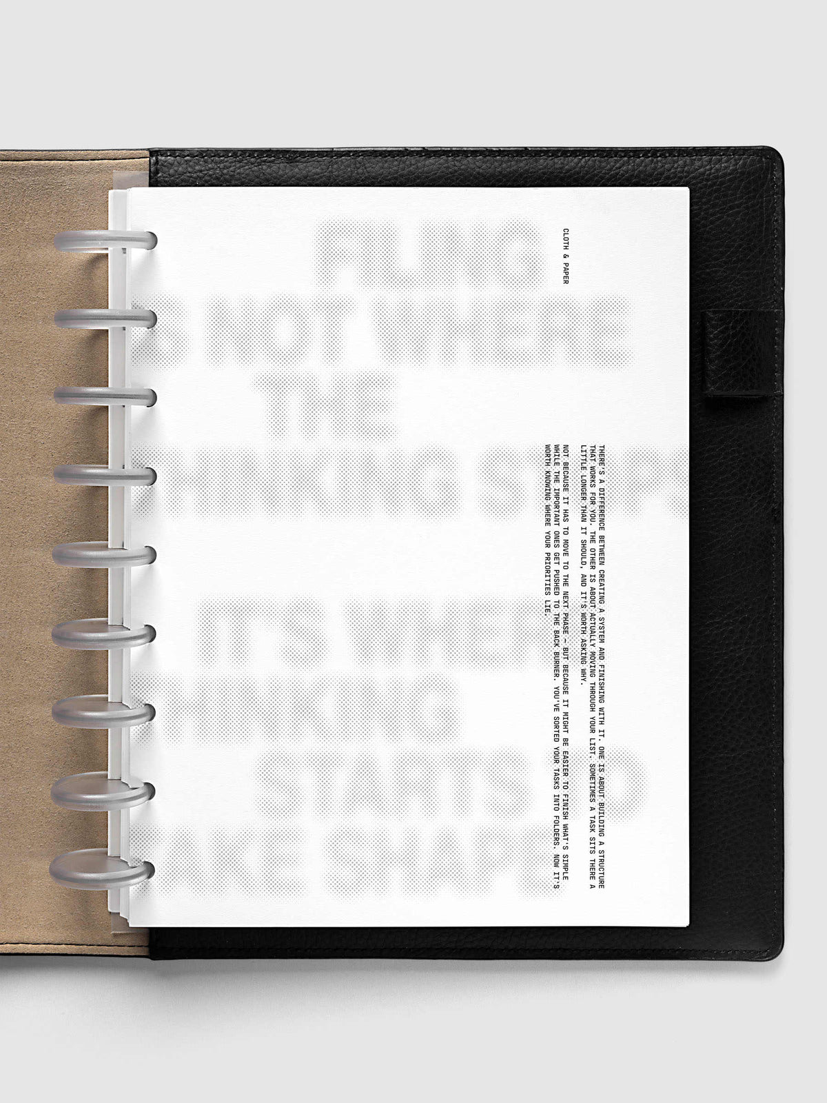 Halftone Planner Dashboard, HP Classic 9-Disc Punch, dashboard on frosted discs in an open black leather planner with a kraft interior panel