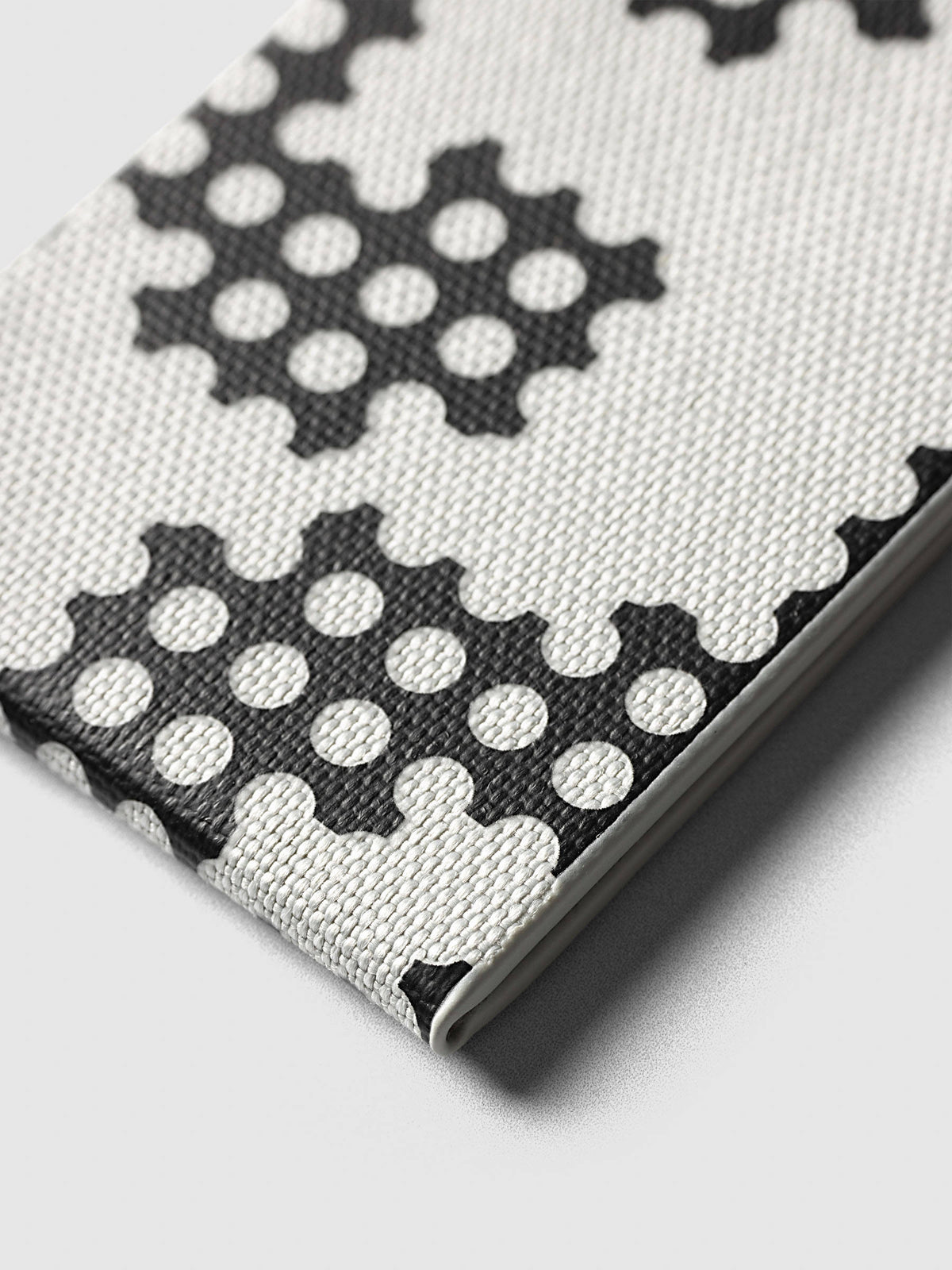 Magnetic Bookmarks Punched Holes & Margin, close-up of the Punched Holes print and the bookcloth weave