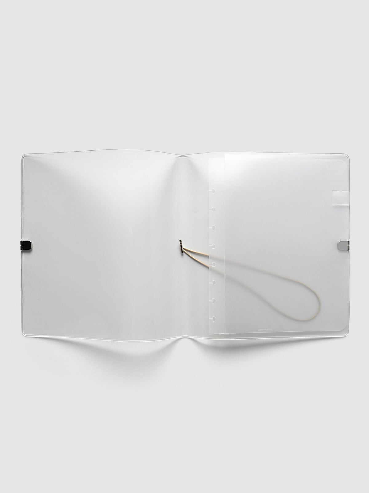 Folio Cover in frosted vinyl, HP Classic (HP Classic 9-Disc Punch), open flat showing the punched disc strip and the beige bungee cord inside