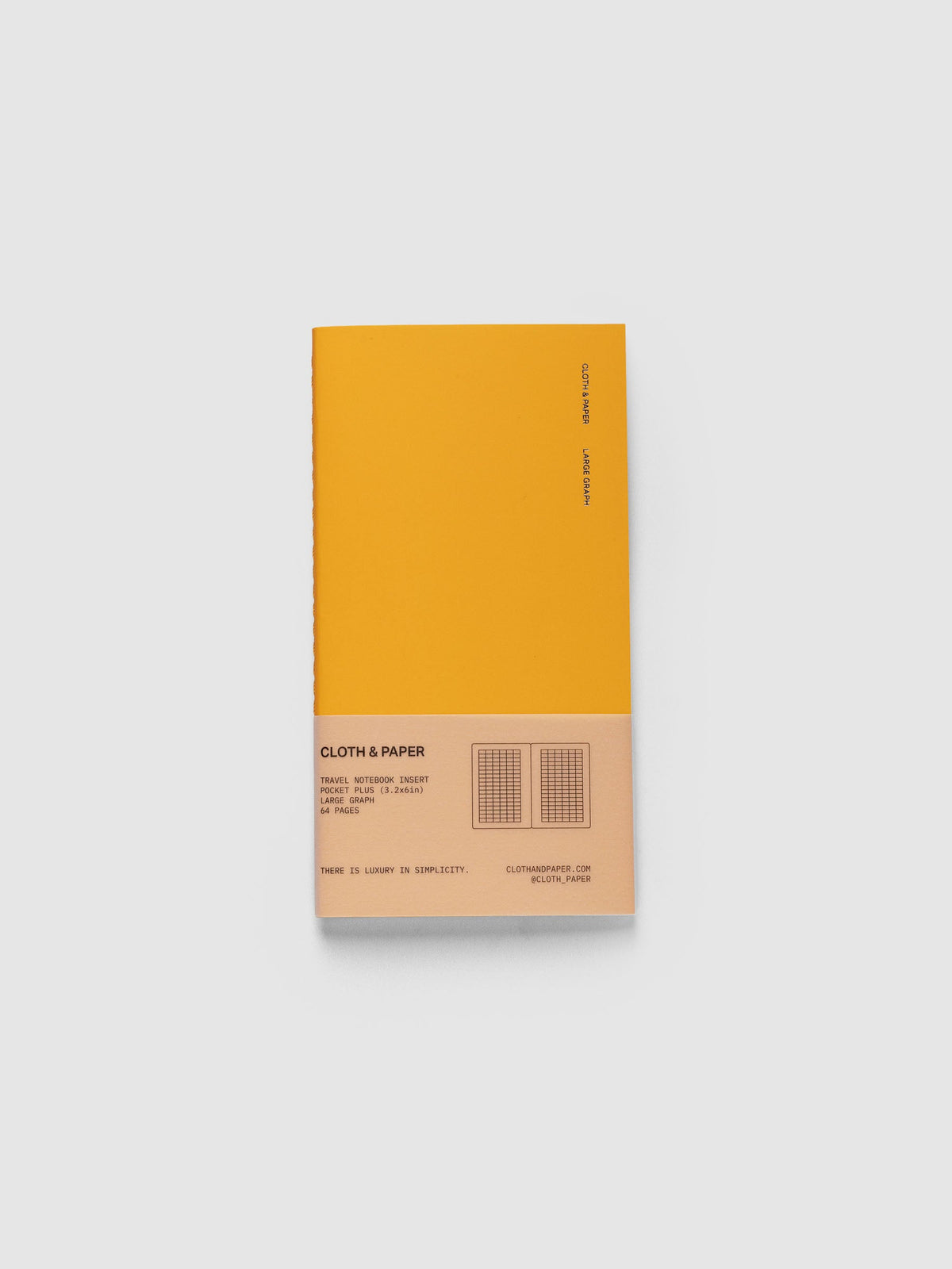 Large Graph Travel Notebook in Tangent, Pocket Plus, orange cover with Cloth & Paper and Large Graph lettering and a peach paper band listing 64 pages