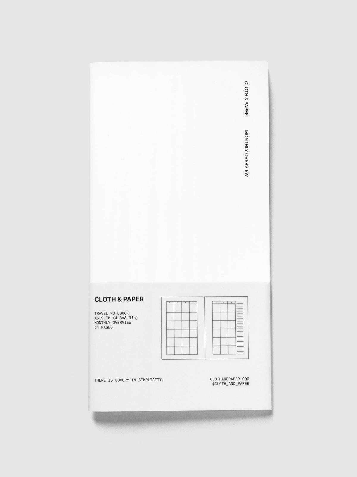 Monthly Overview Travel Notebook in Le Blanc, A5 Slim, white cover with Cloth & Paper and Monthly Overview lettering and a white paper band listing 64 pages