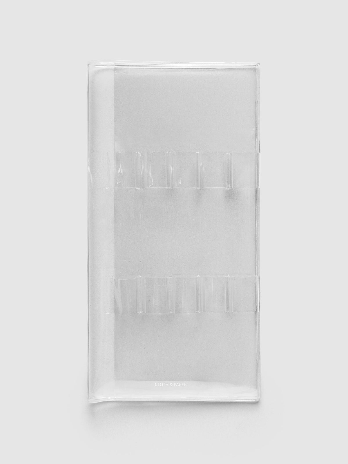 Travel Tool Kit, A5 Slim, in clear vinyl, folded closed with two rows of clear pen loops and the Cloth & Paper logo