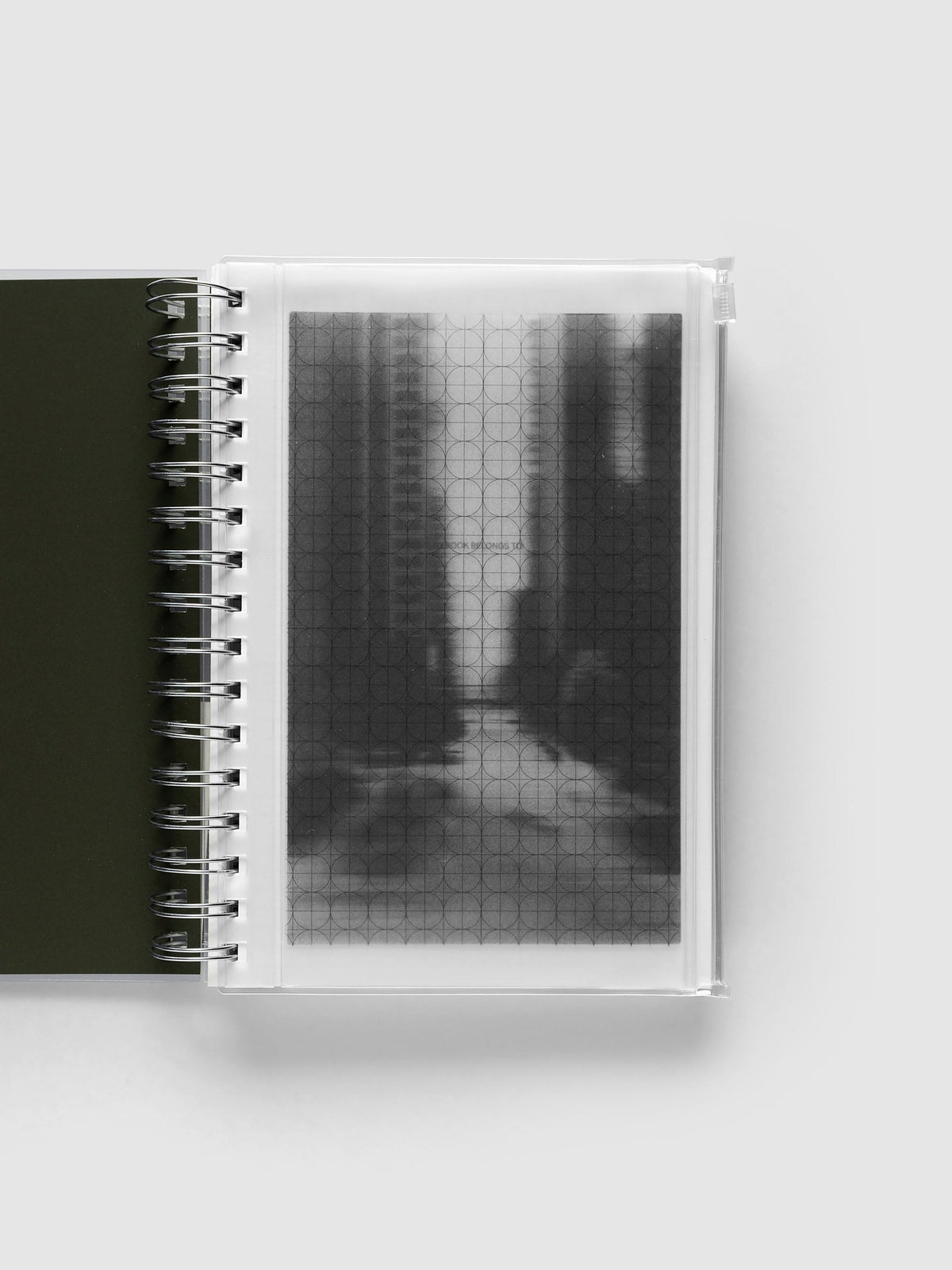 Graph Storage Holder bound into a spiral notebook in size A5 Spiral, with the graph overlay and photo insert visible through the frosted pouch.