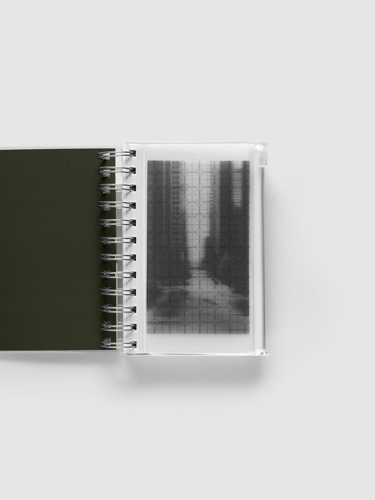 Graph Storage Holder bound into a spiral notebook in size CP Petite Spiral, with the graph overlay and photo insert visible through the frosted pouch.