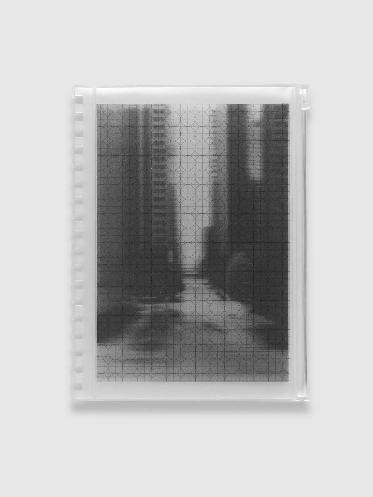 Frosted transparent zippered storage pouch pre-punched for HP Classic Spiral notebooks, holding the black and white blurred photo insert under the clear circle and graph overlay. Shown in size HP Classic Spiral.