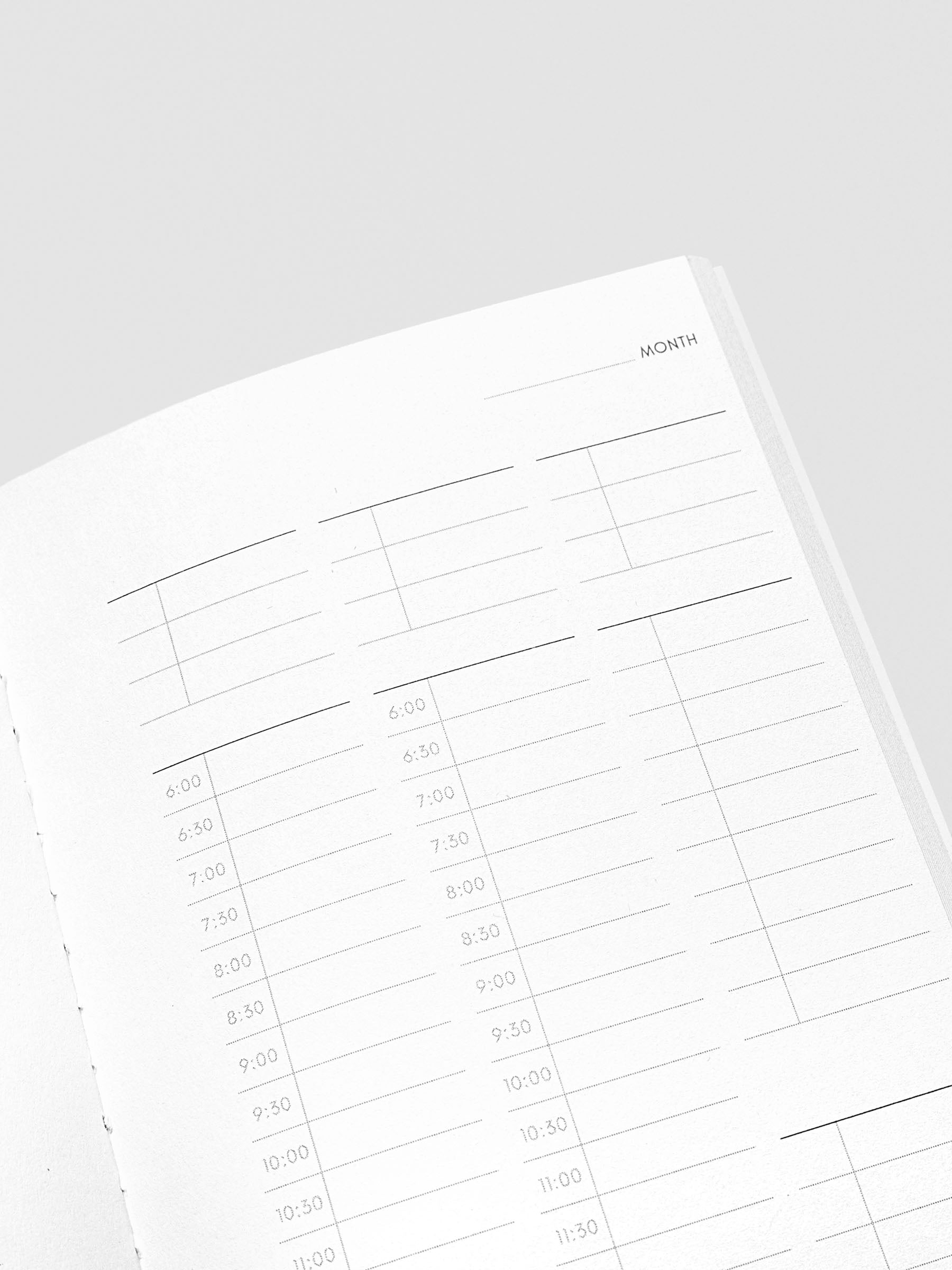 Travel Journal in size Pocket Plus in color Bordeux with 30 Minute Time Block pages shown close up.