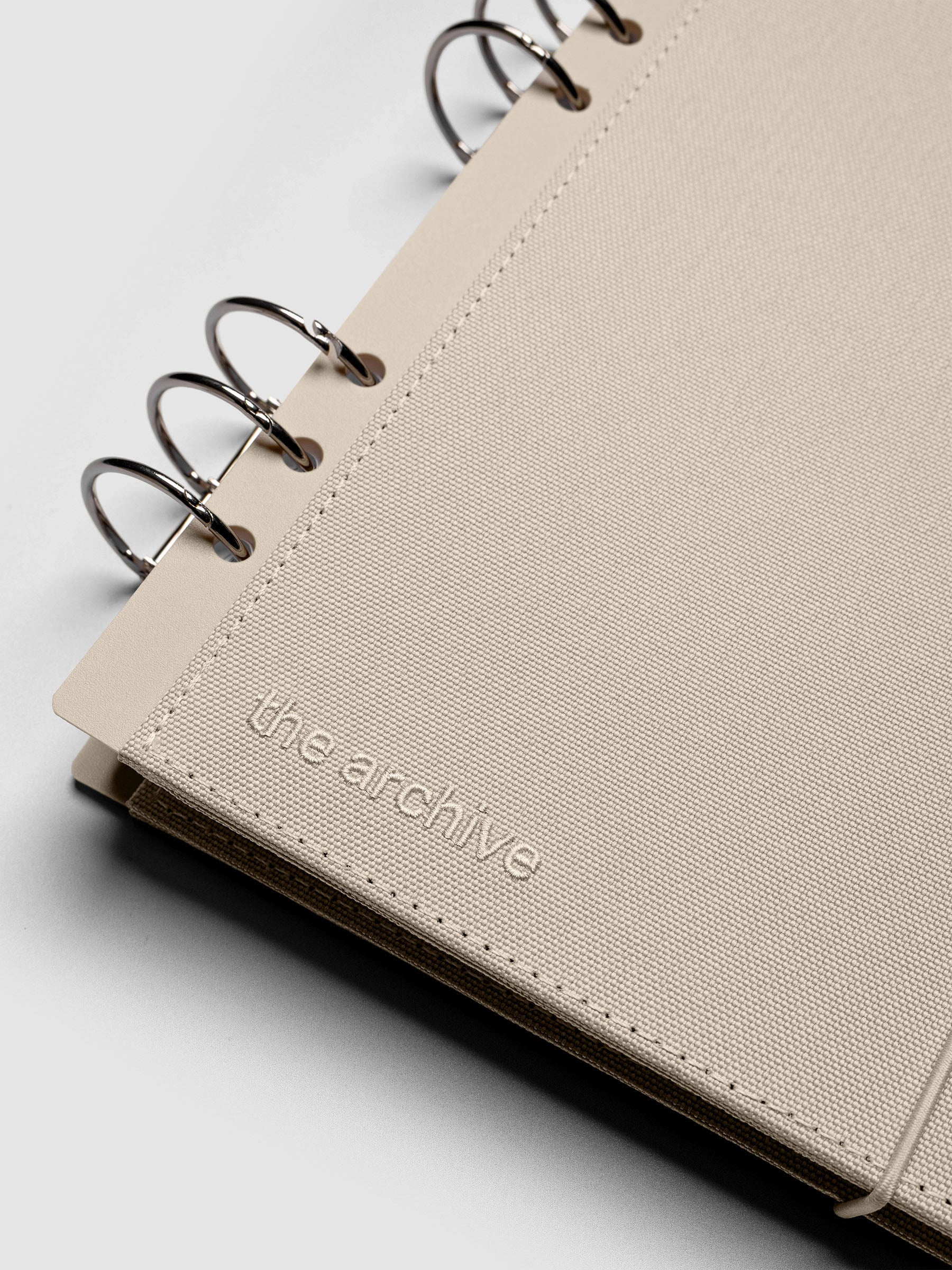 Close up of 6-ring punch on an A5 planner cover.
