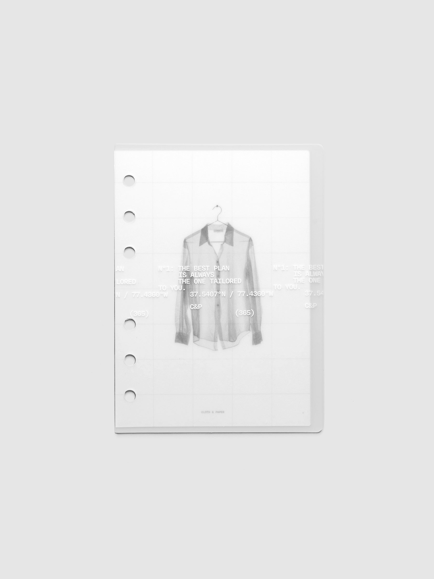 Transparent planner cover set with white printed text design and accompanying black and white dashboard with an image of a tailored shirt on a hanger. Pre-punched for 6-ring planners shown in size A6.