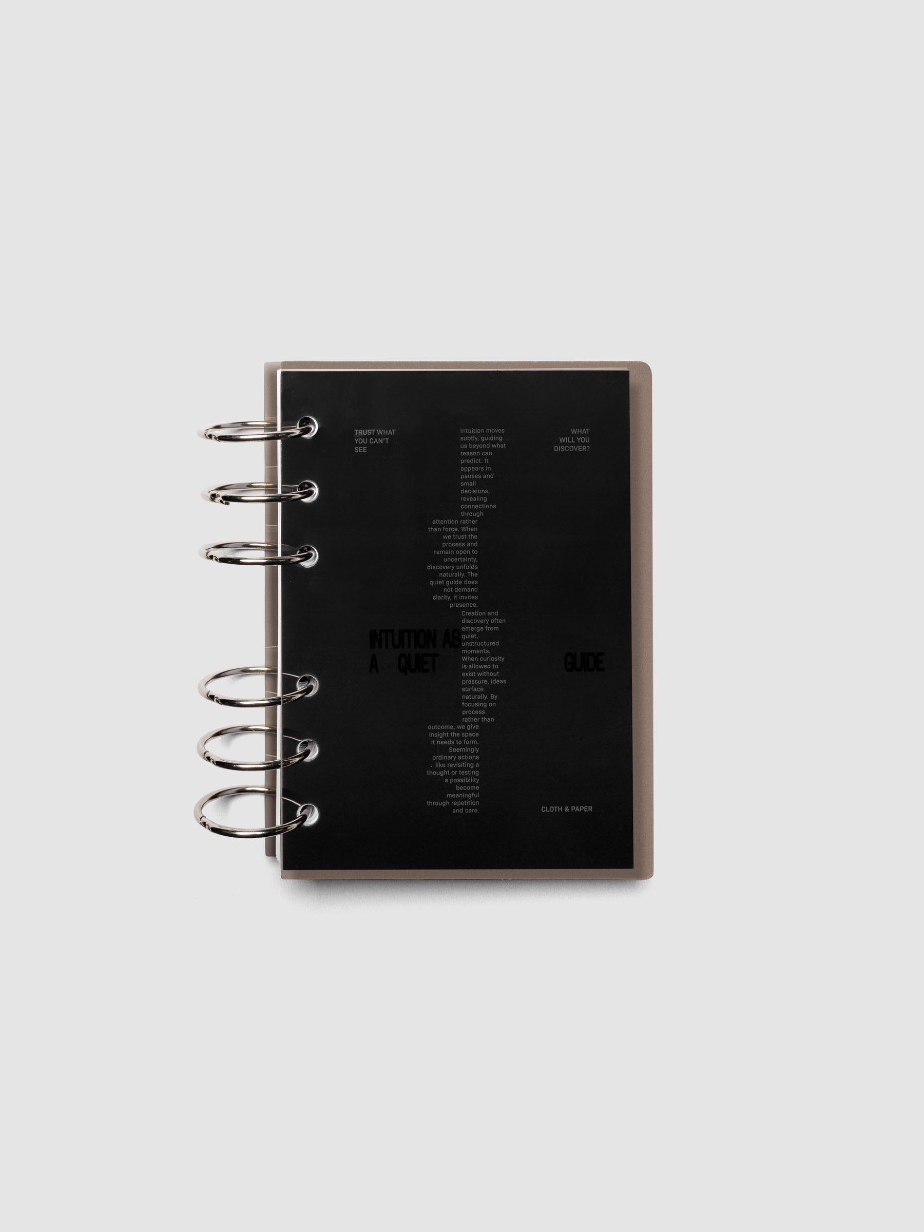 Black Intuition Ultra Thin Planner Cover + Dashboard Set in size A6 6-Ring shown inside a planner