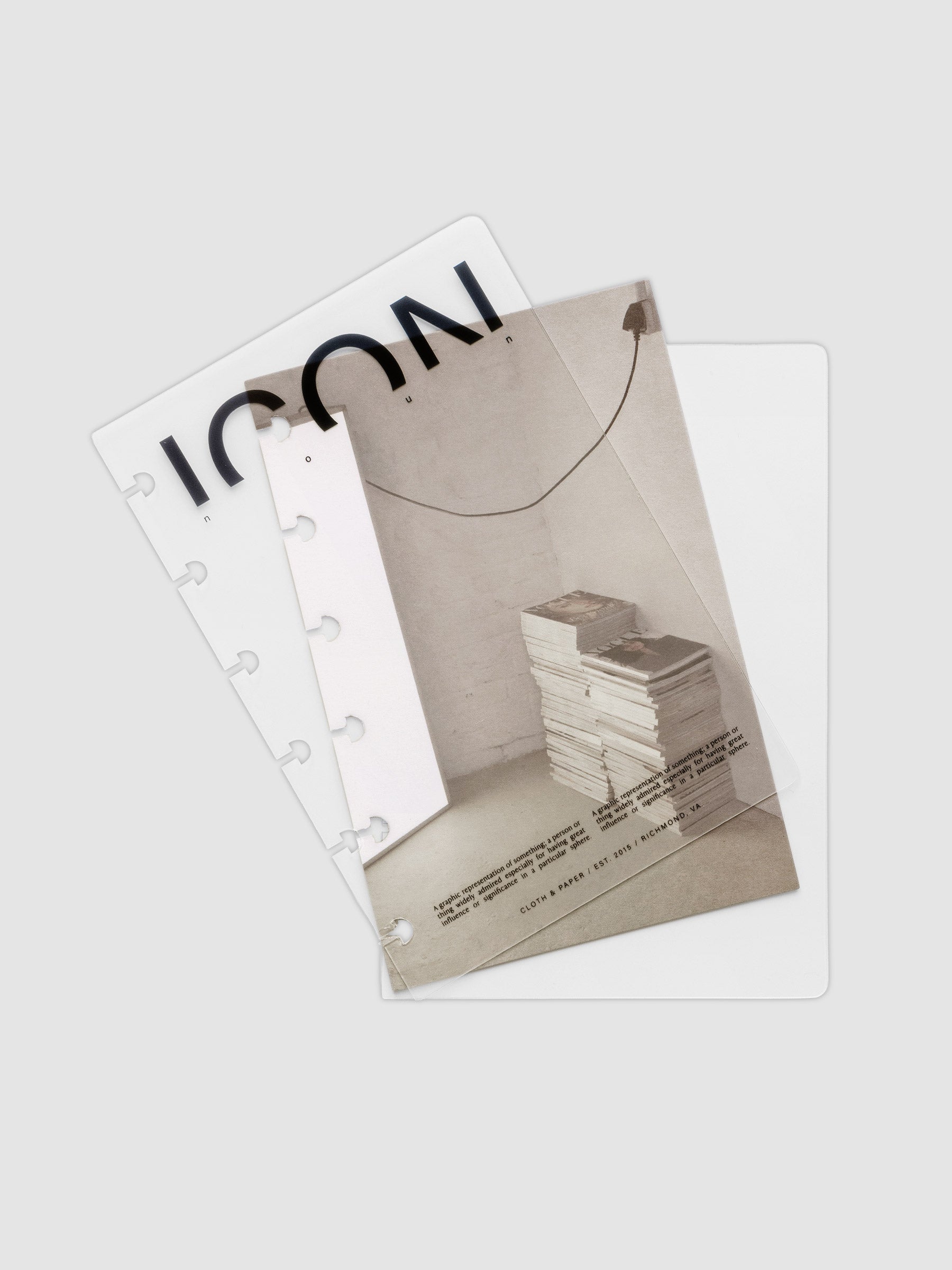 Clear planner cover with black text and a photographic dashboard shown pre-punched for discbound planners in size CP Petite.