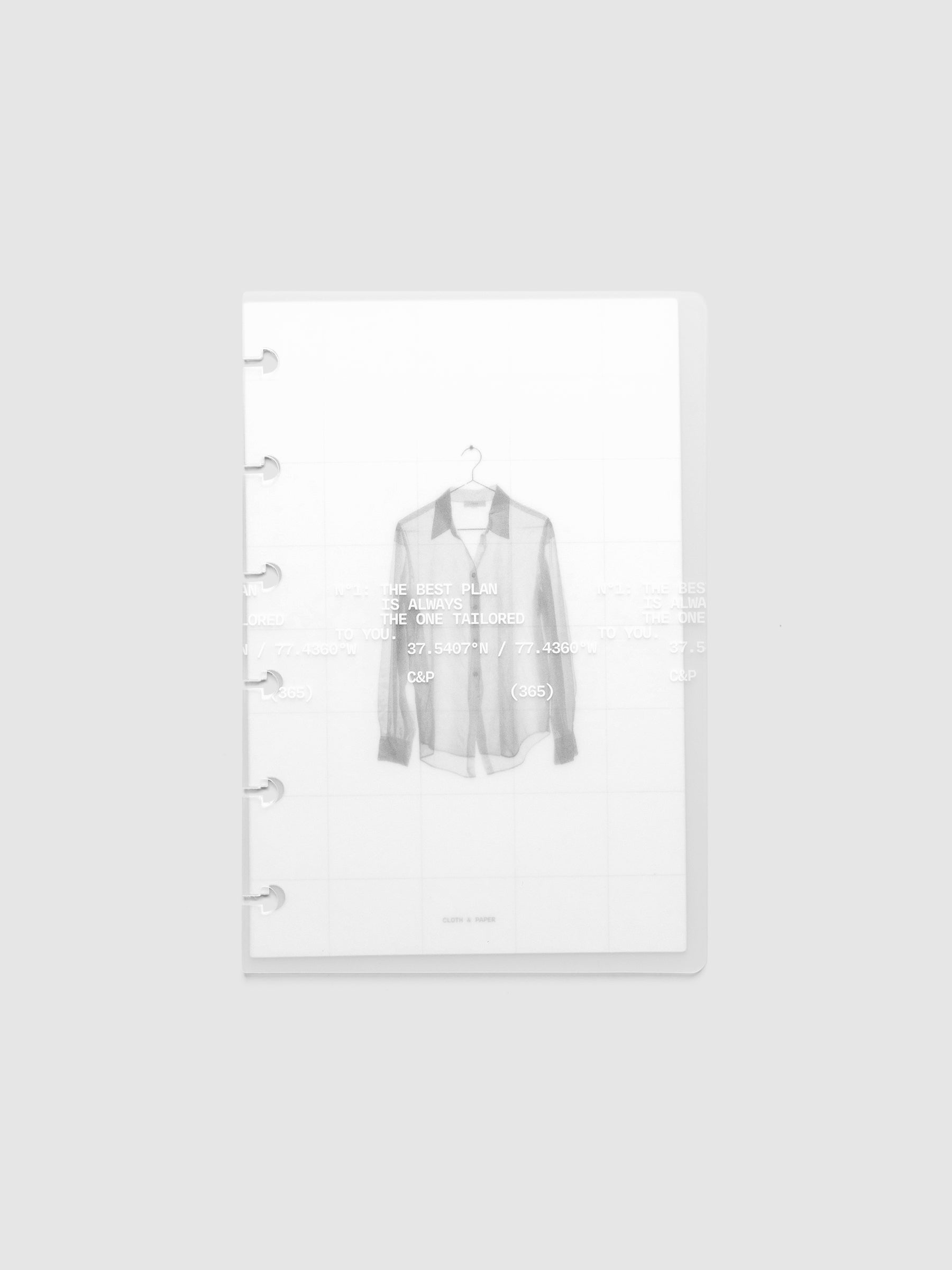 Transparent planner cover set with white printed text design and accompanying black and white dashboard with an image of a tailored shirt on a hanger. Pre-punched for 6-disc planners shown in size CP Petite.