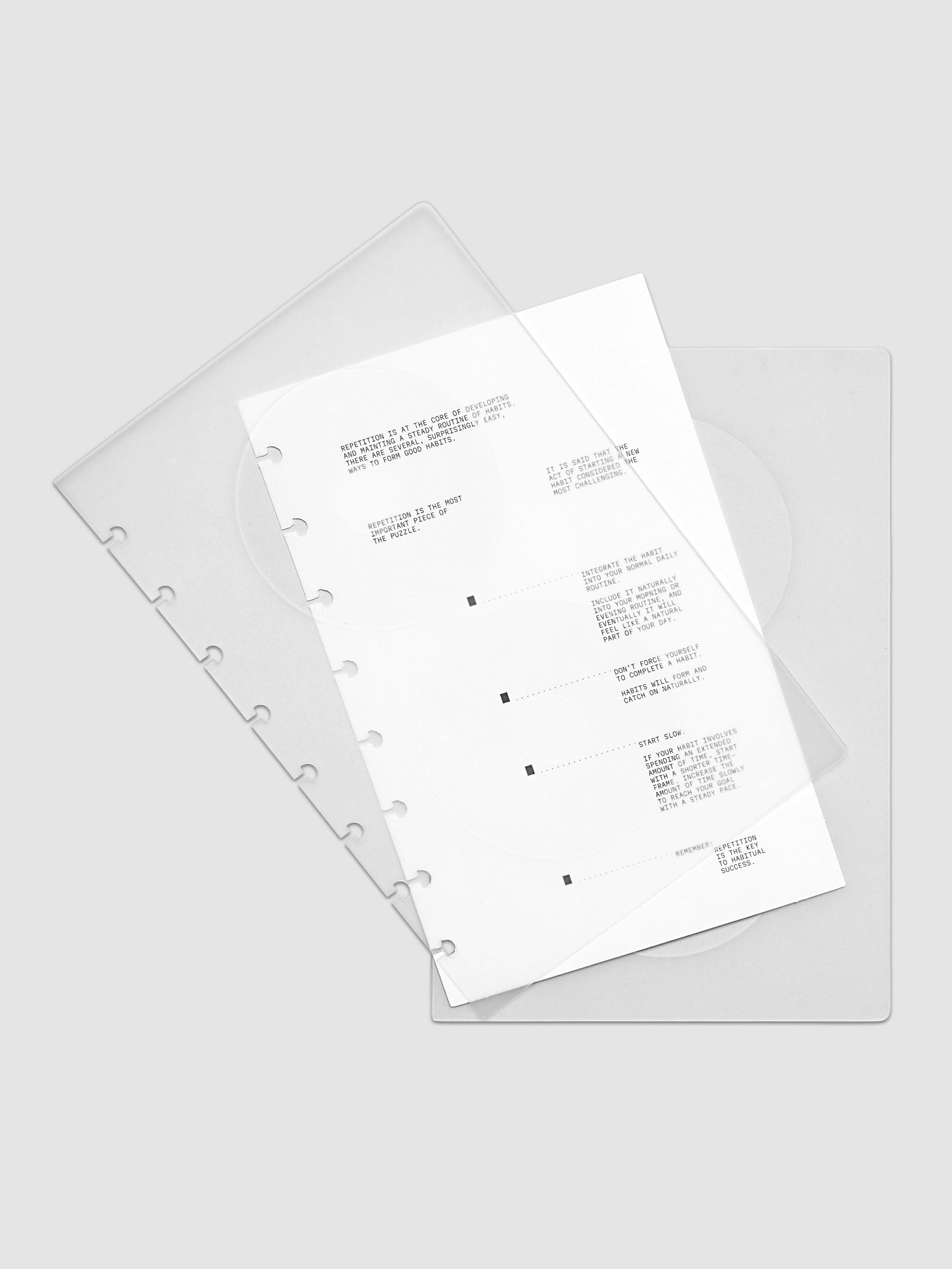 On Repeat Planner Cover + Dashboard Set  shown fanned out in size Half Letter, pre-punched for discbound notebooks and planners.