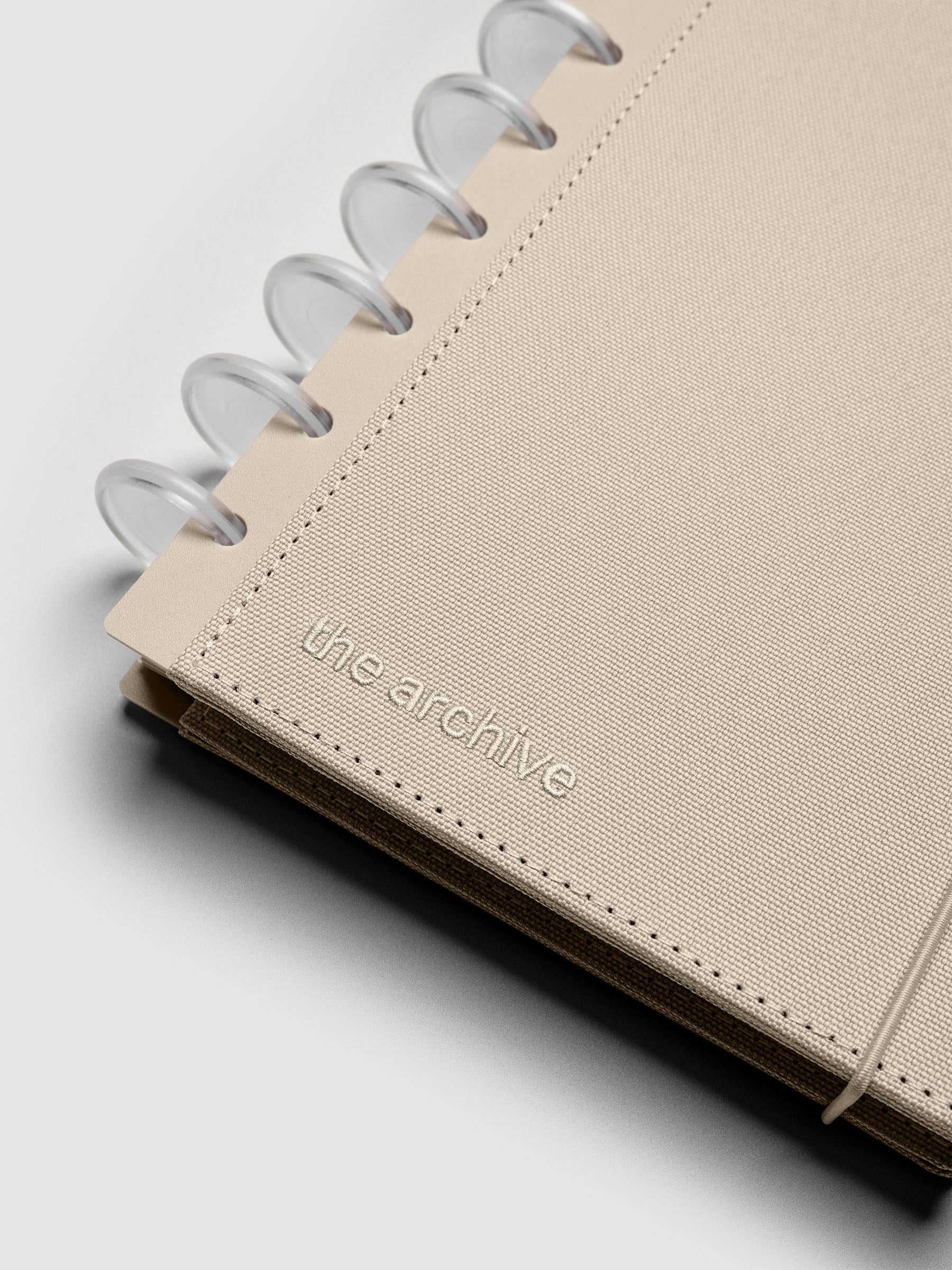 Close up of the disc punch on the Half Letter sized Archive Bookcloth Cover Set.