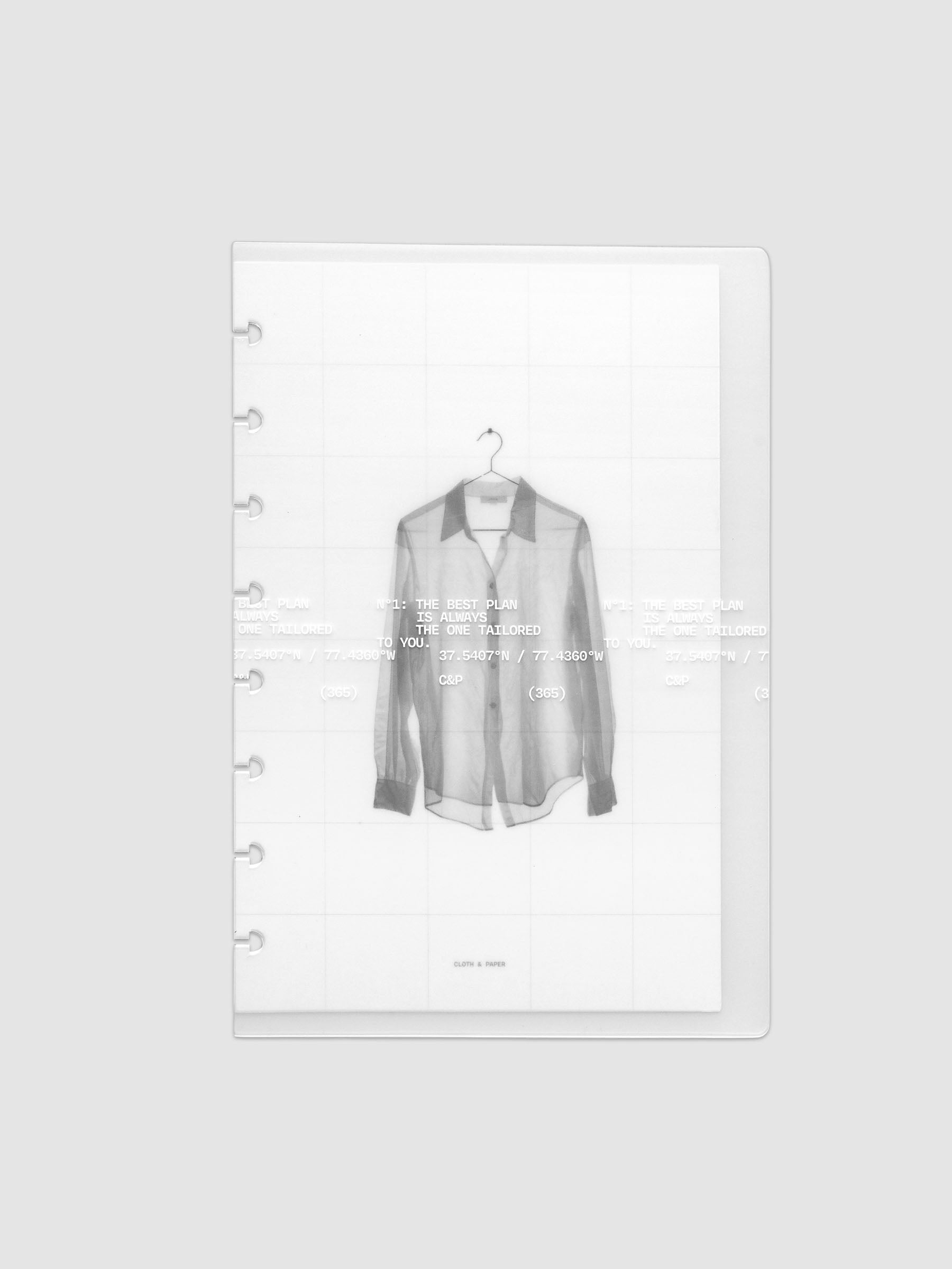 Transparent planner cover set with white printed text design and accompanying black and white dashboard with an image of a tailored shirt on a hanger. Pre-punched for 8-disc planners shown in size Half Letter.