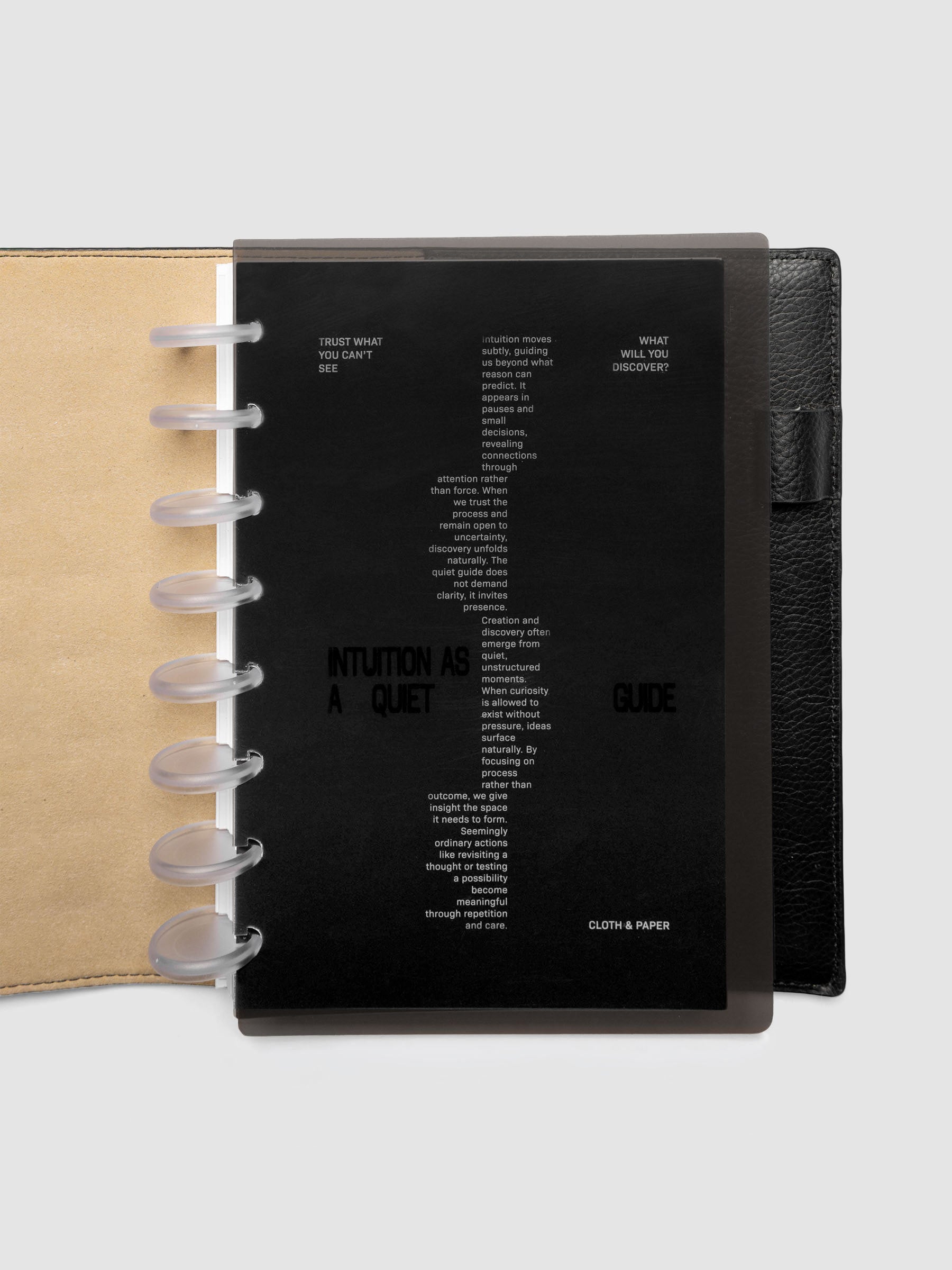Black Intuition Ultra Thin Planner Cover + Dashboard Set in size Half Letter 8-Disc shown inside a planner