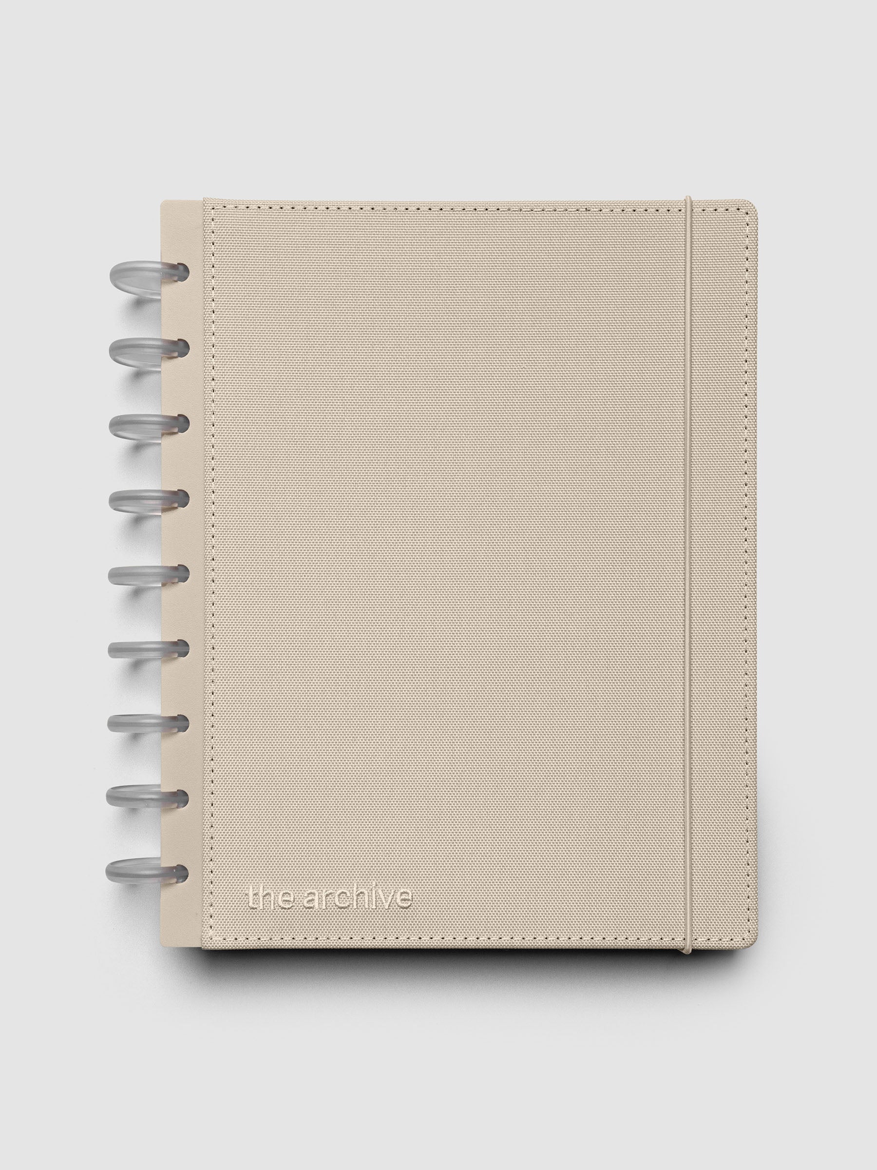HP Classic discbound planner with a beige bookcloth cover against a grey background.