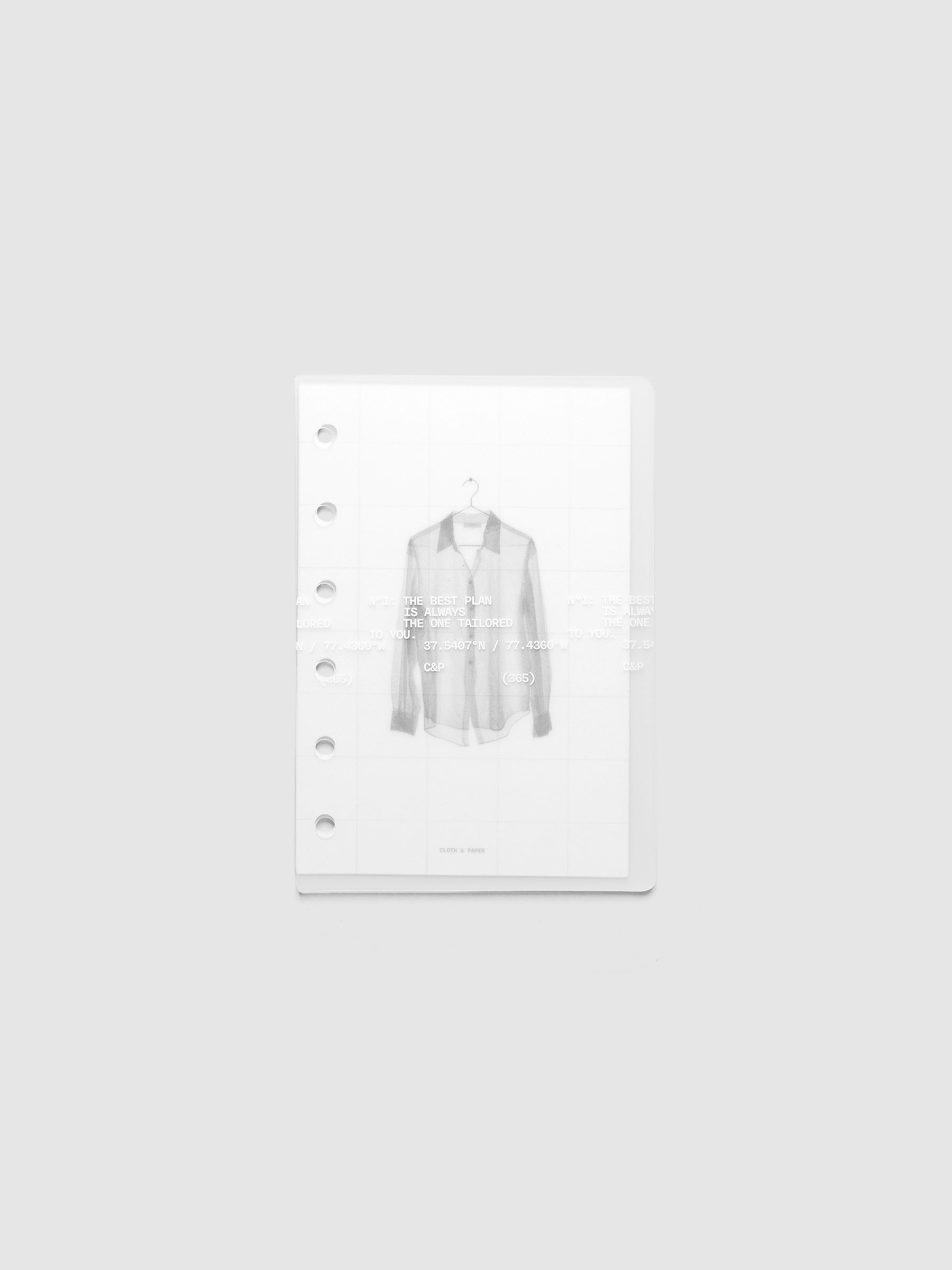 Transparent planner cover set with white printed text design and accompanying black and white dashboard with an image of a tailored shirt on a hanger. Pre-punched for 6-ring planners shown in size Pocket.