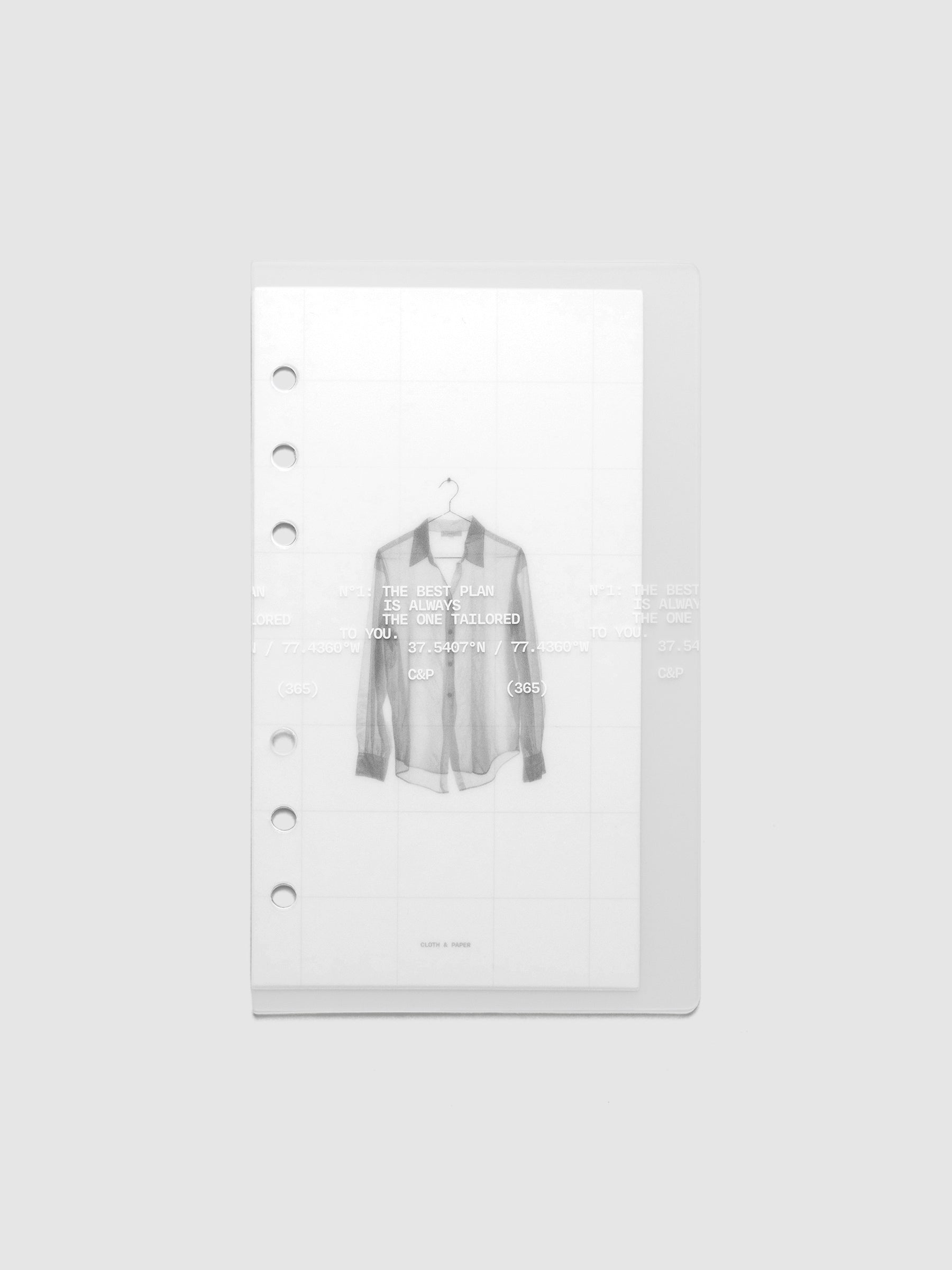 Transparent planner cover set with white printed text design and accompanying black and white dashboard with an image of a tailored shirt on a hanger. Pre-punched for 6-ring planners shown in size Personal.