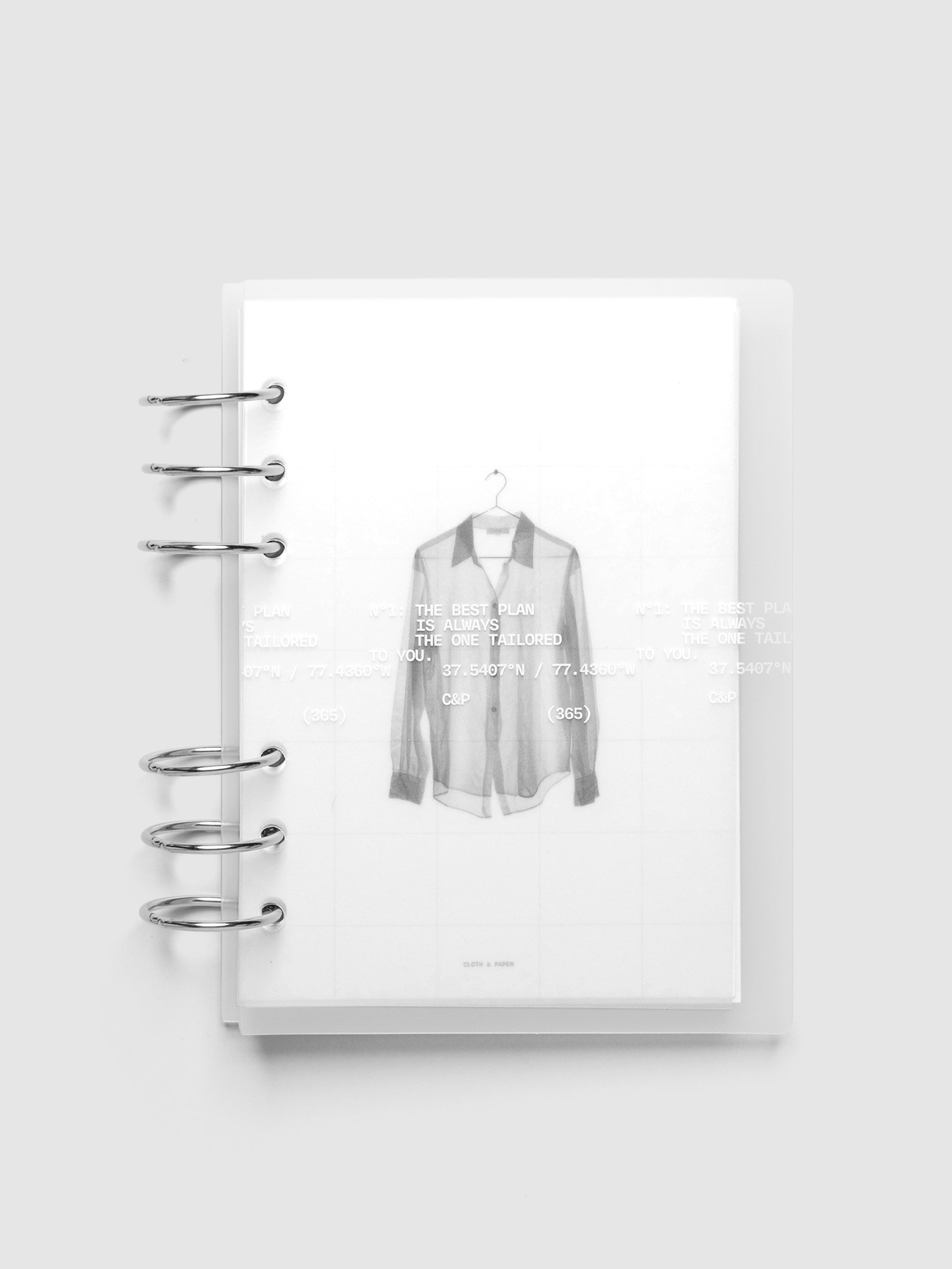 Transparent planner cover set with white printed text design and accompanying black and white dashboard with an image of a tailored shirt on a hanger. Shown ring bound in size Personal Wide.