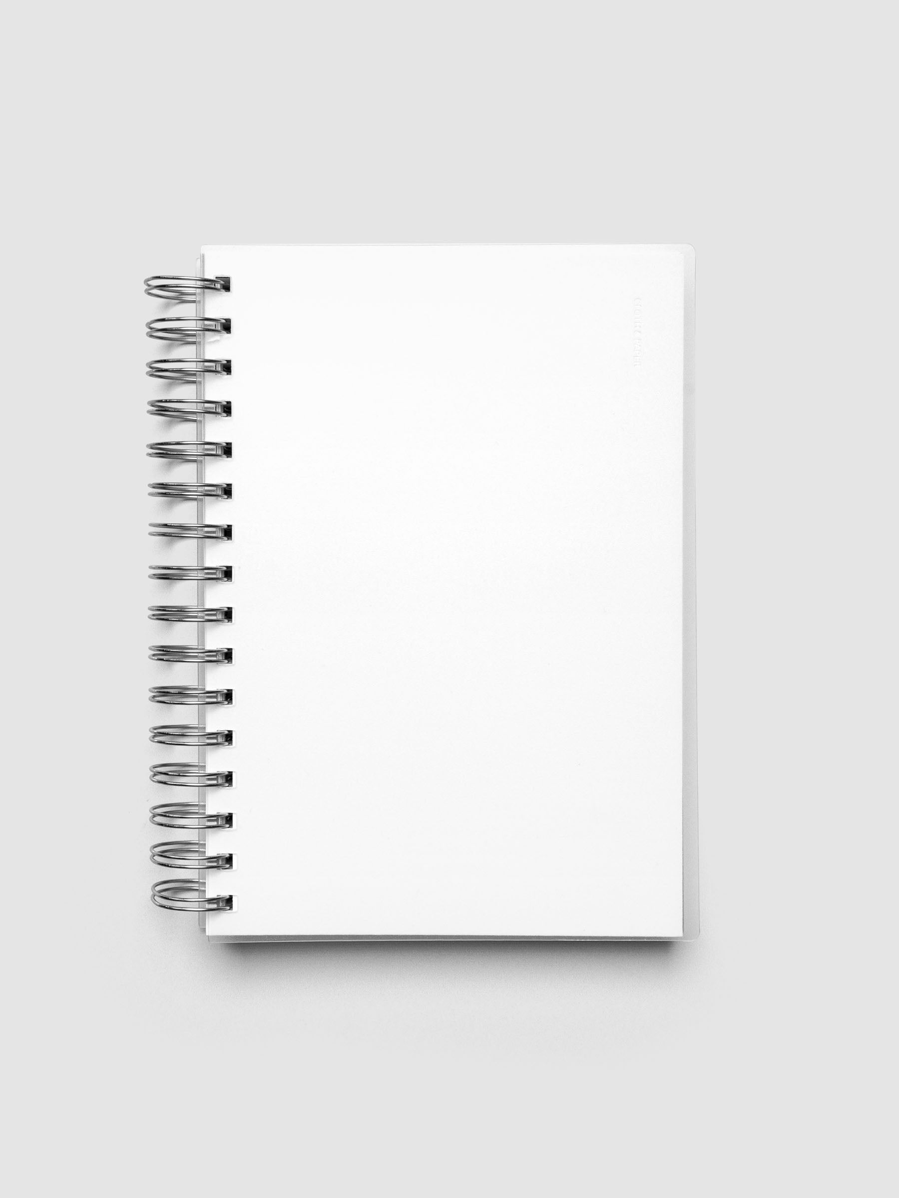 Spiral Notebook dashboard in the color Le Blanc shown in size A5 inside a notebook with the frosted transparent cover overlayed.