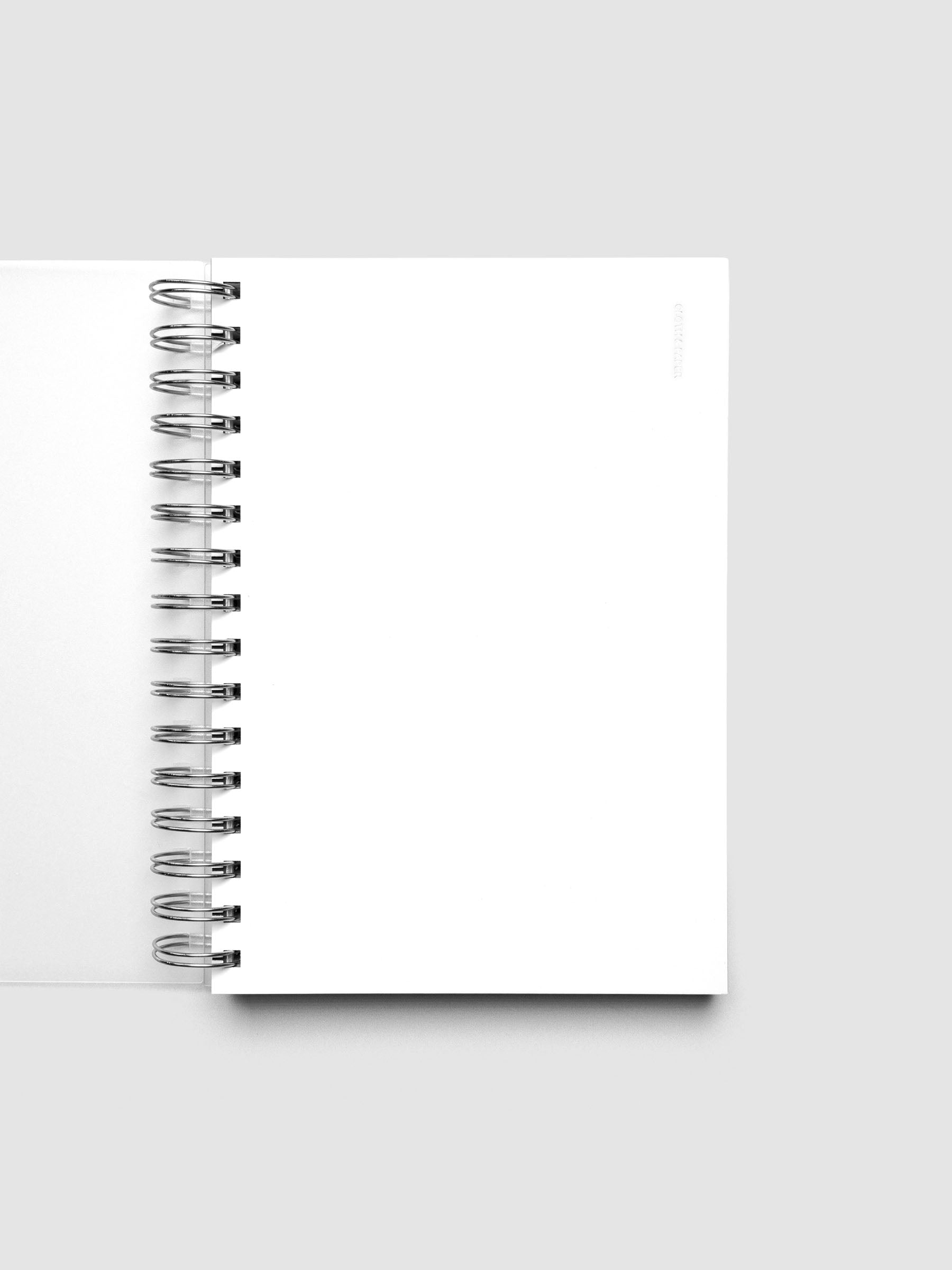 Spiral Notebook dashboard in the color Le Blanc shown in size A5 inside a notebook.