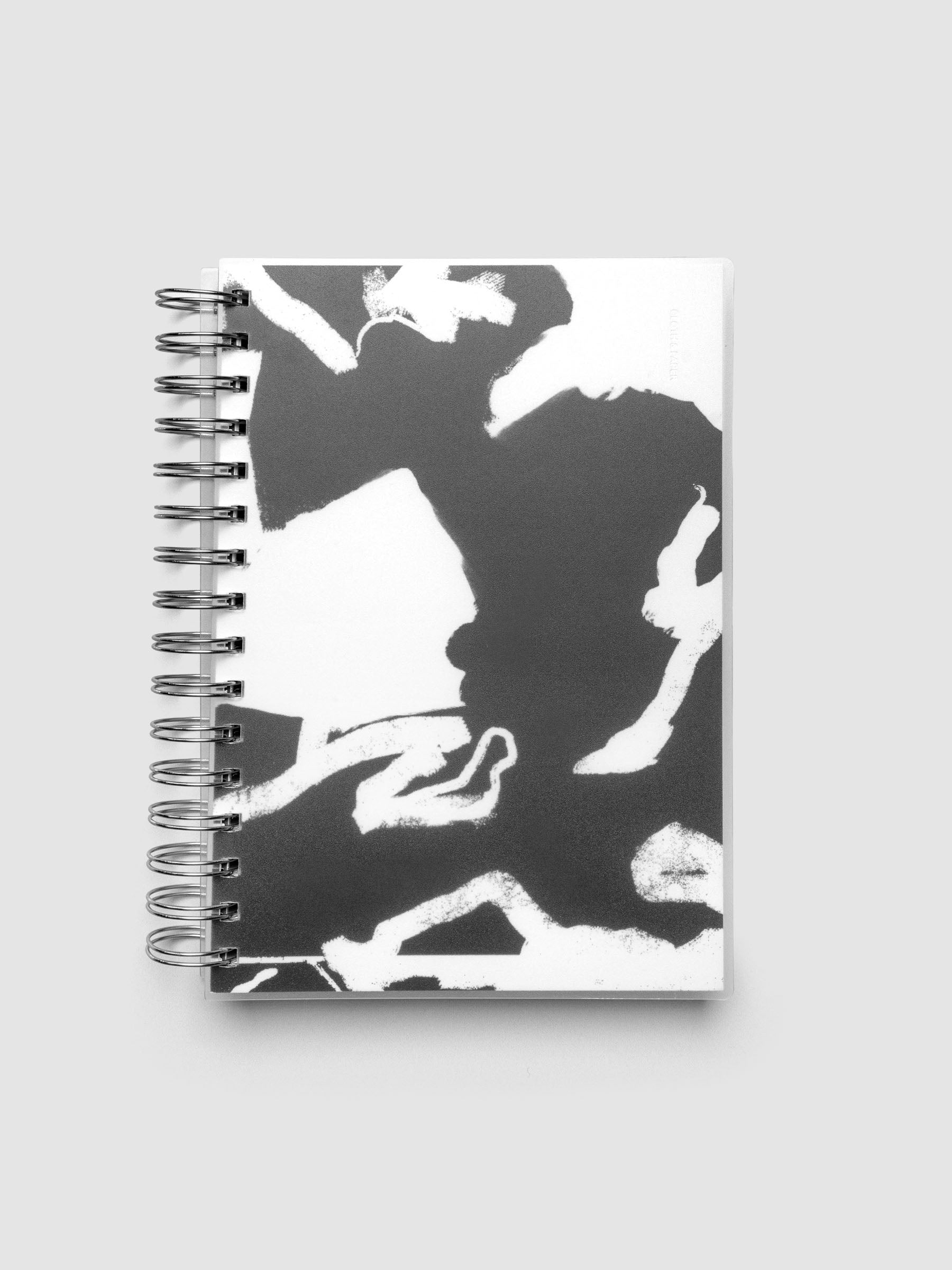 Spiral Notebook dashboard in the pattern Drybrush shown in size A5 inside a notebook with the frosted transparent cover overlayed.