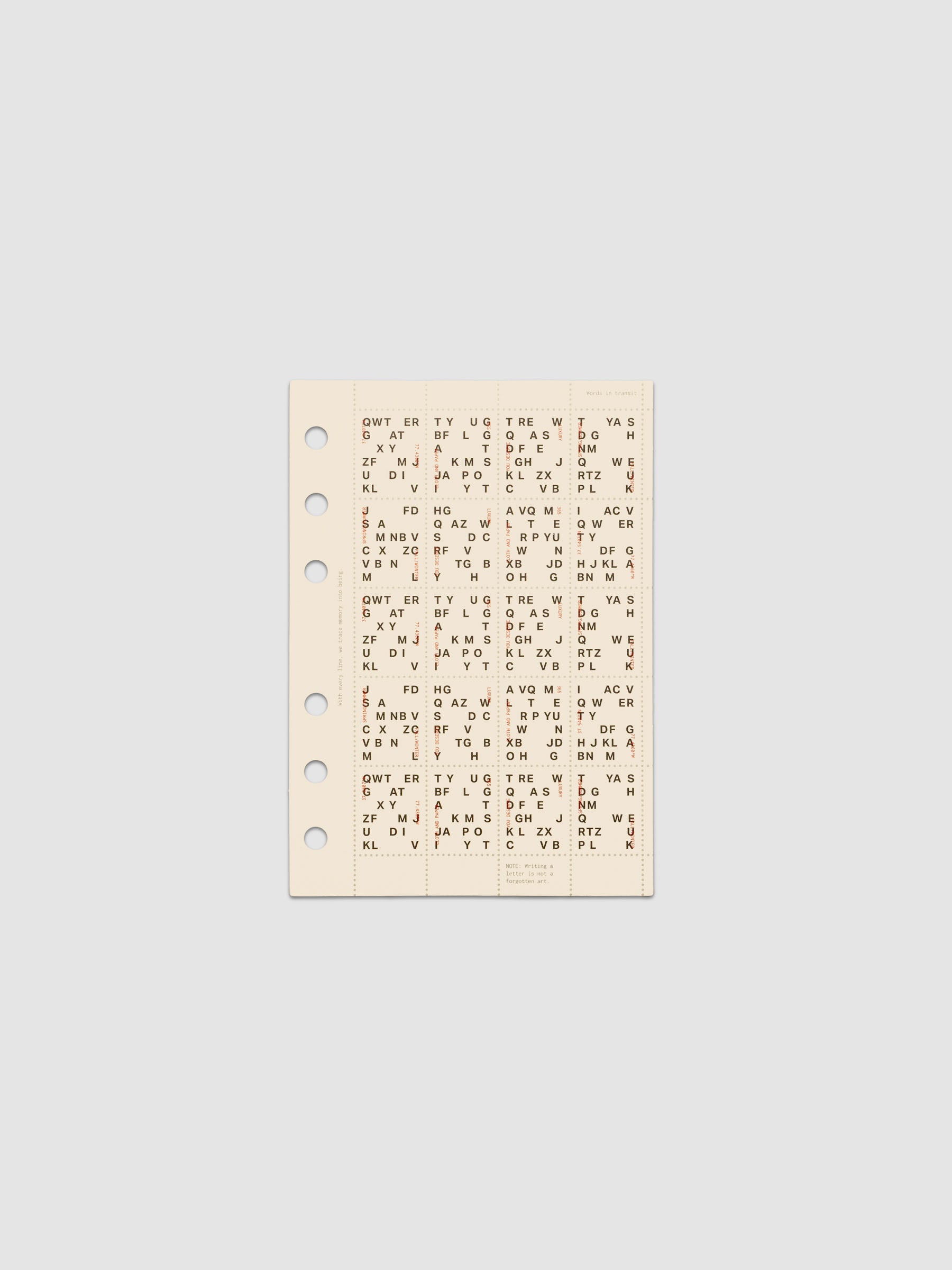 Cream colored Stamp Sheet Planner Dashboard with black text design shown in size A6 against a grey background.