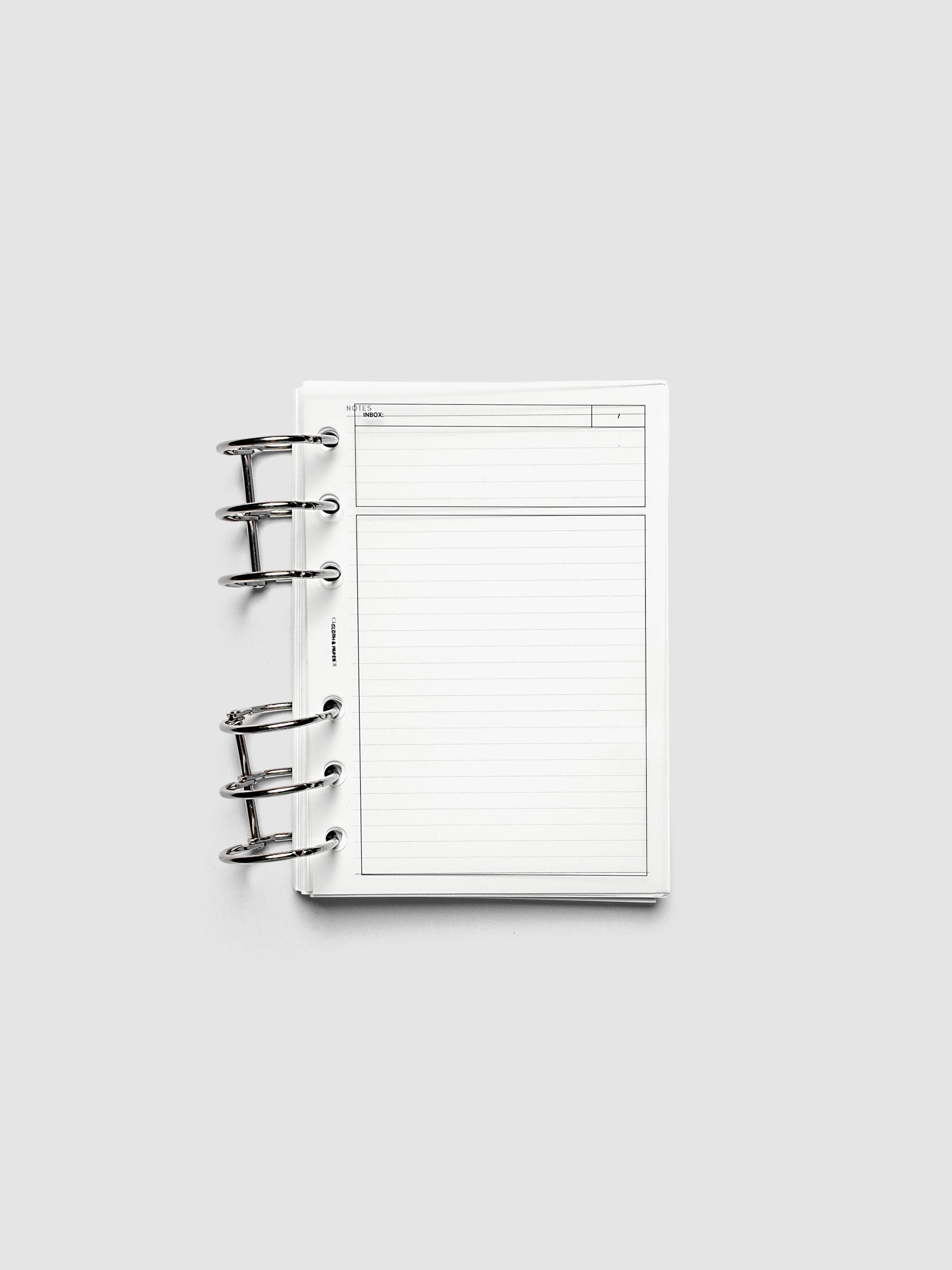 Crystal Clear Inbox Planner Dashboard shown ring bound in an A6 sized planner.