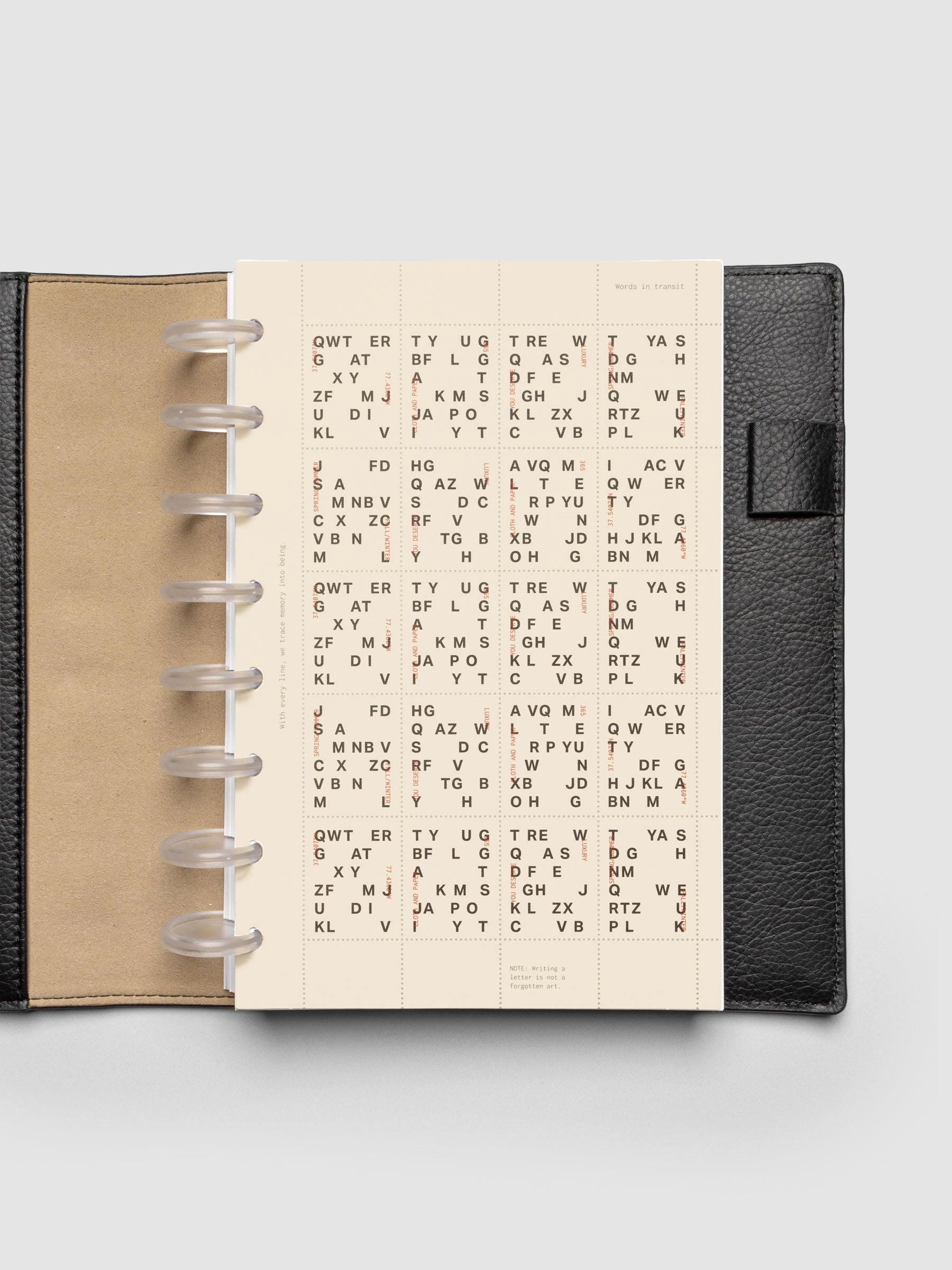 Stamp Sheet Planner Dashboard shown in a Half Letter black leather folio.