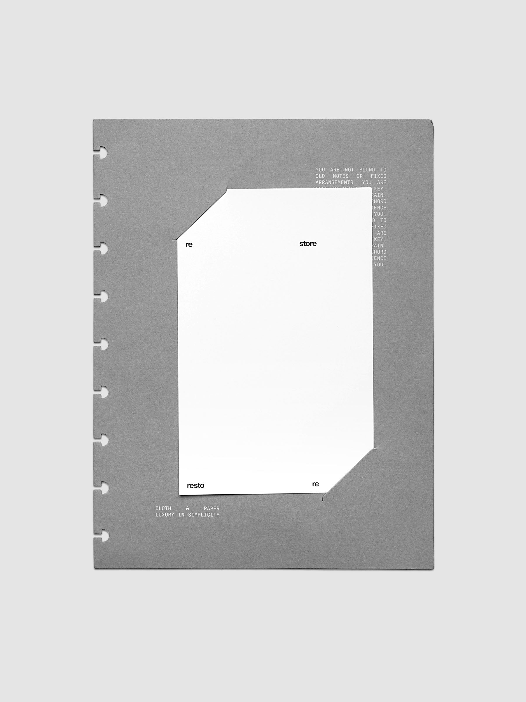 Grey cardstock planner dashboard with white plastic card inserted in slits with white printed text shown in size HP Classic for discbound planners.