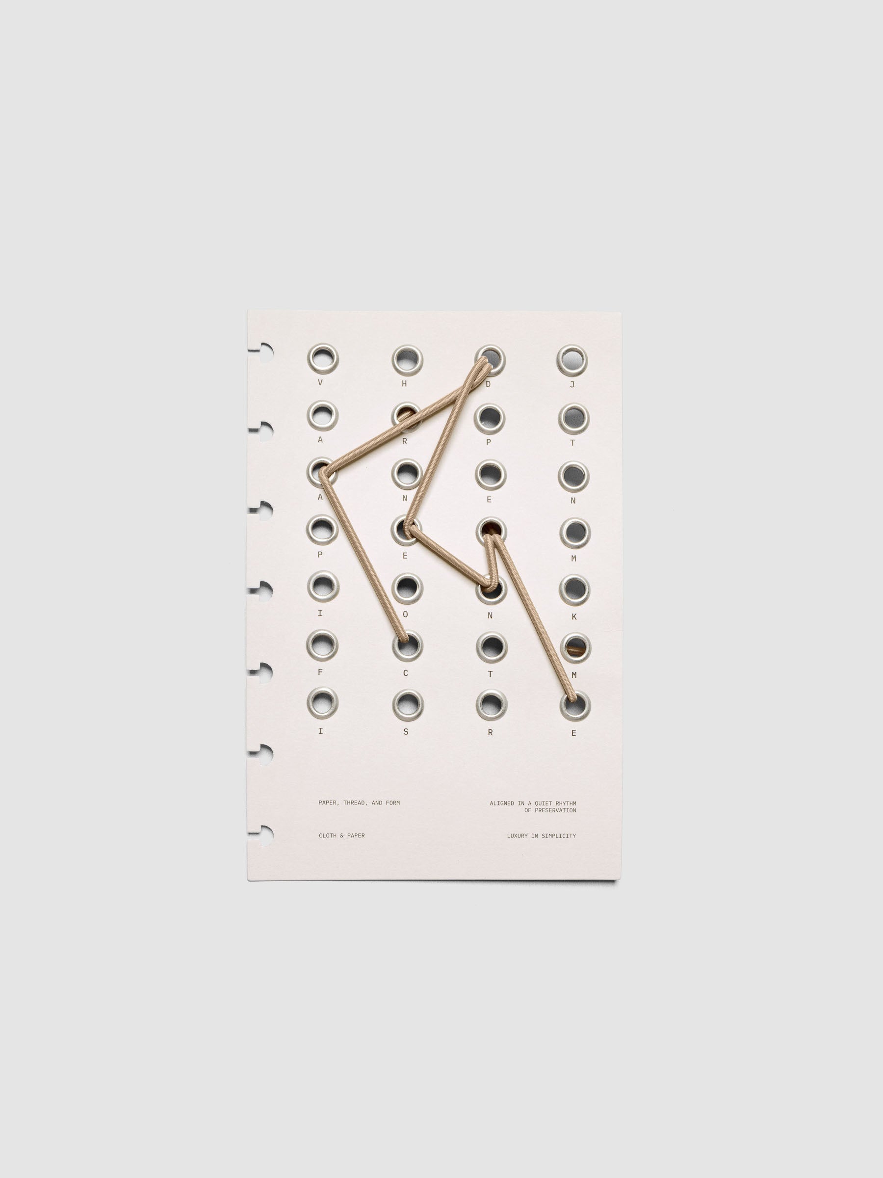 Cadence Dashboard with grommets and string on beige cardstock shown in size HP Mini for discbound planners and notebooks.