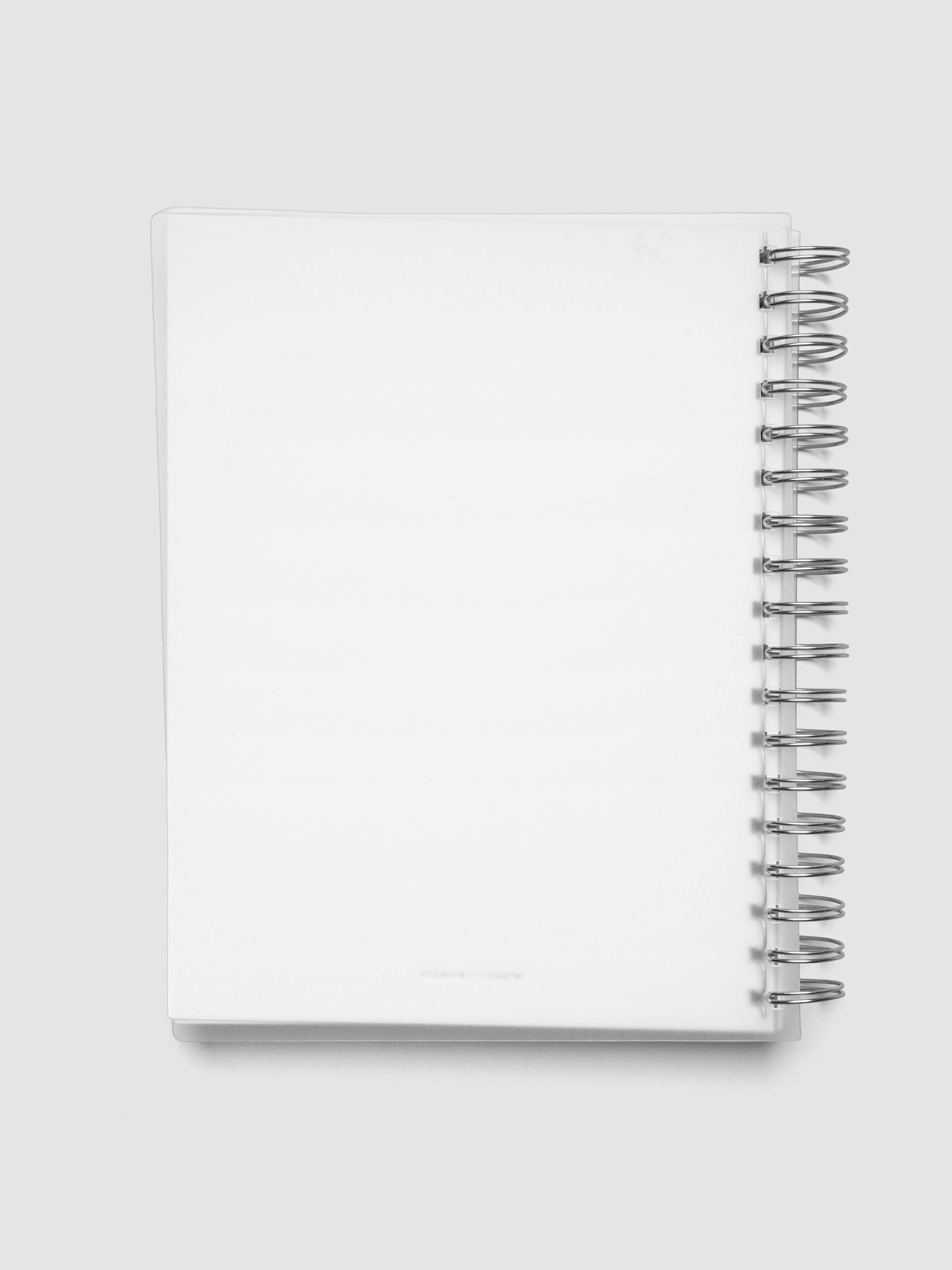Spiral Notebook dashboard in the color Le Blanc shown in size HP Classic inside a notebook with the frosted transparent cover overlayed.