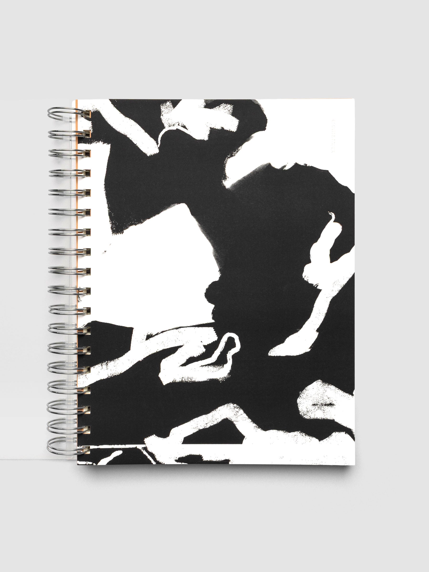 Spiral Notebook dashboard in the pattern Drybrush shown in size HP Classic inside a notebook with the frosted transparent cover overlayed.