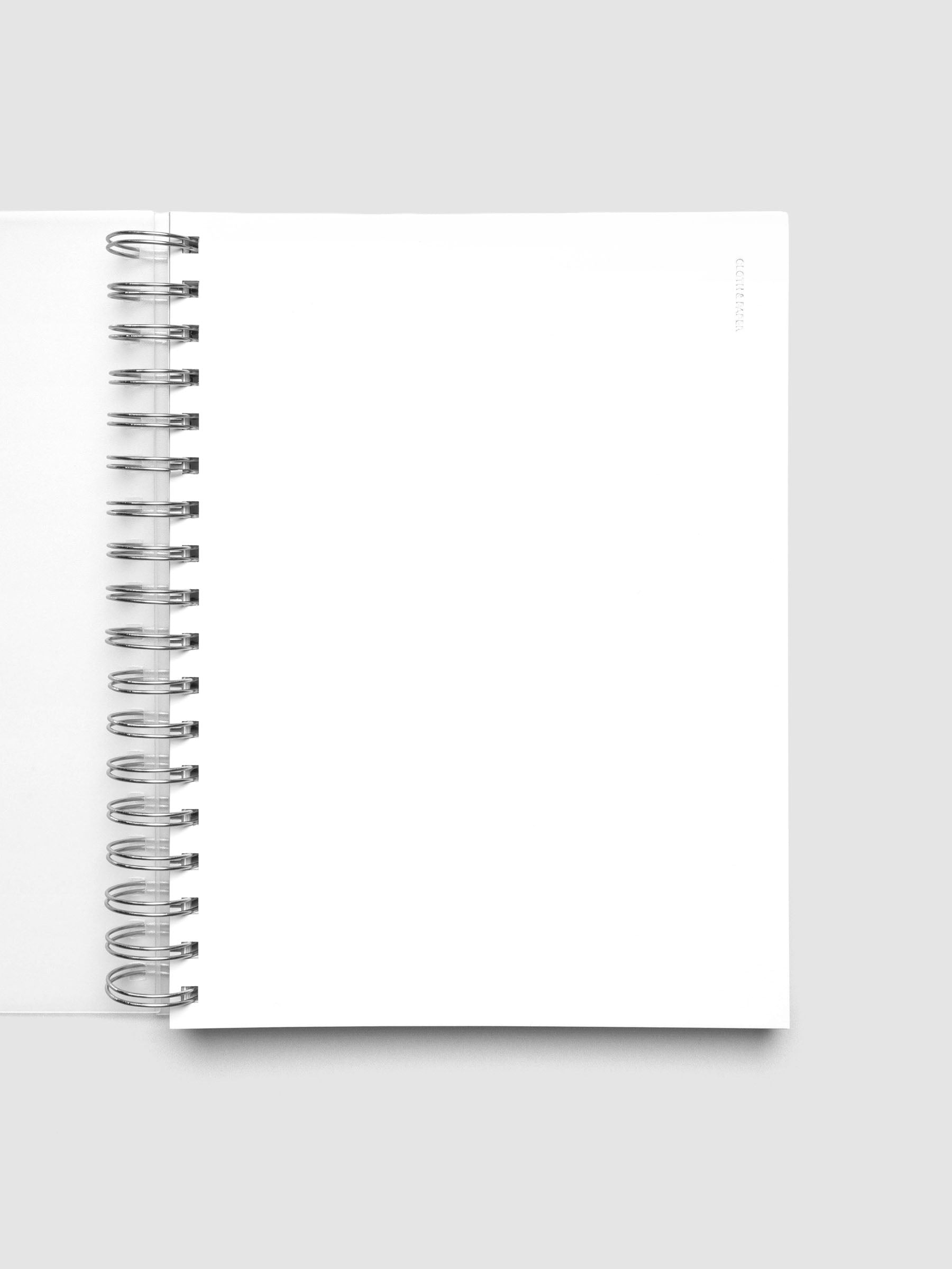 Spiral Notebook dashboard in the color Le Blanc shown in size HP Classic inside a notebook with the frosted transparent cover overlayed.