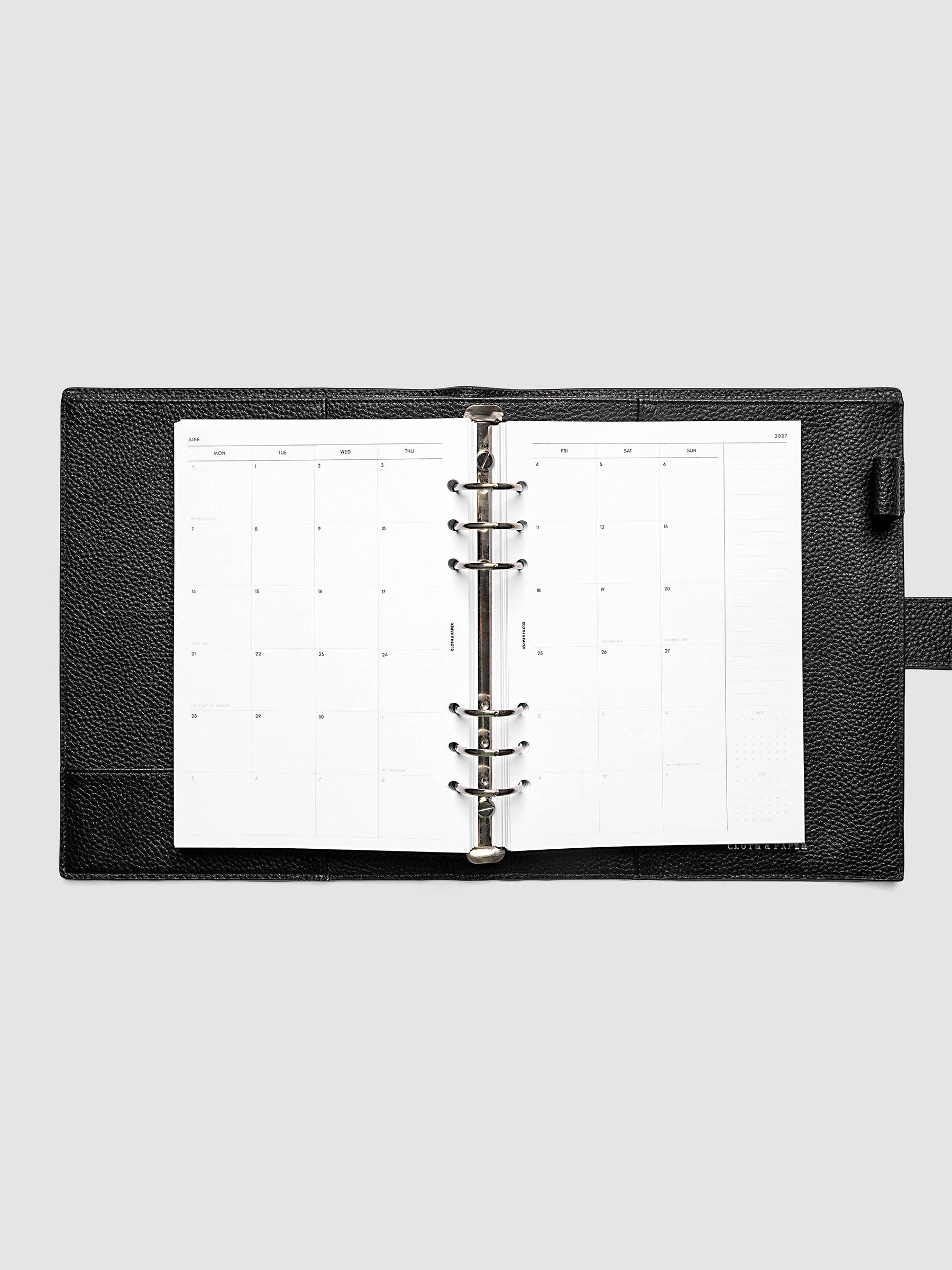 2027 Dated Monthly Planner Inserts, Monday Start, A5 6-Ring Punch, full two-page monthly calendar spread with Monday start, notes column, and mini calendars in the bottom right corner shown inside a planner