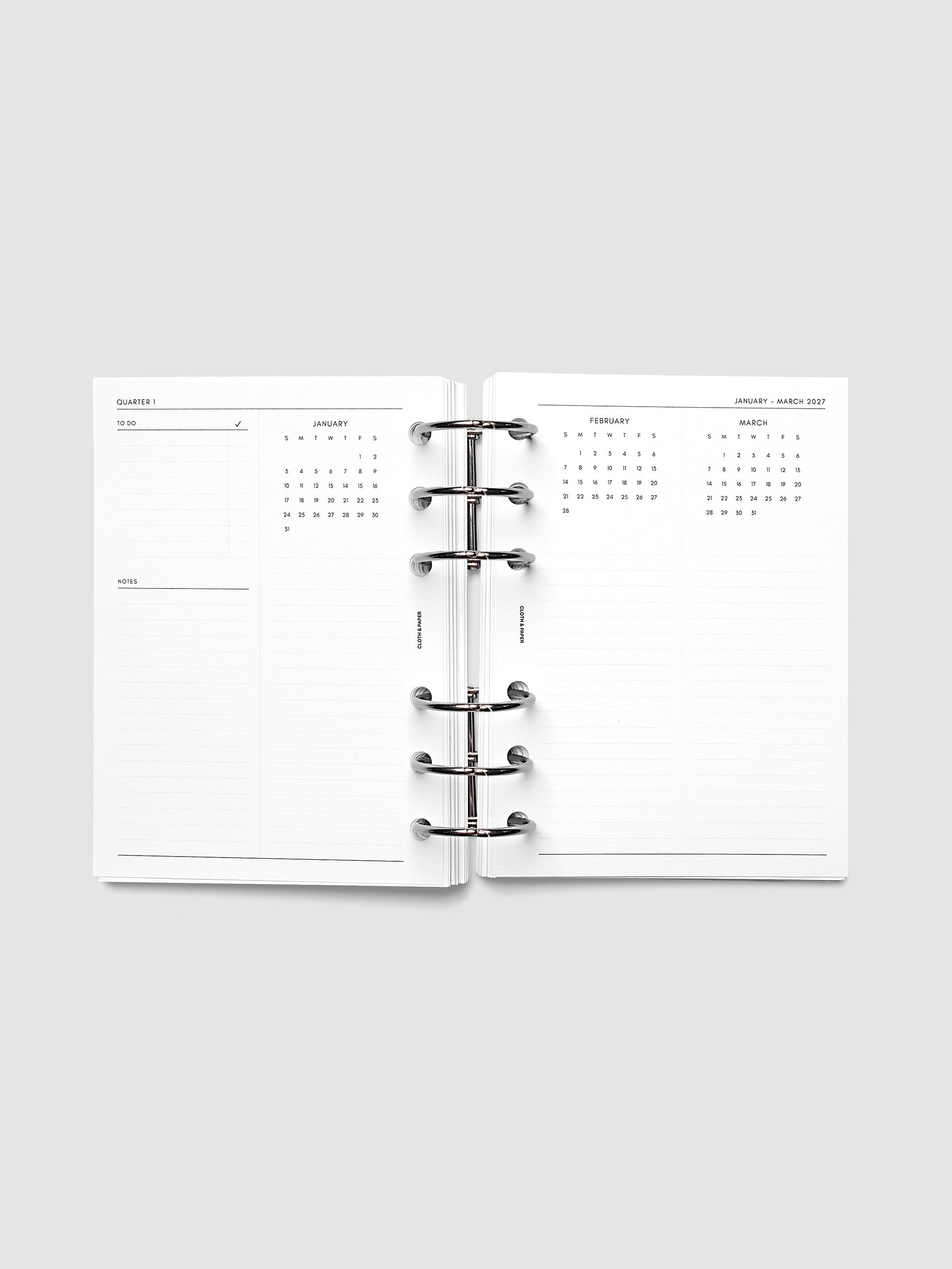 2027 Dated Yearly Overview Planner Inserts Sunday Start, A6 6-Ring Punch, full quarterly spread showing goal-setting, to-do, and notes sections on the left page alongside three monthly calendar views with notes sections on the right page, shown inside a planner