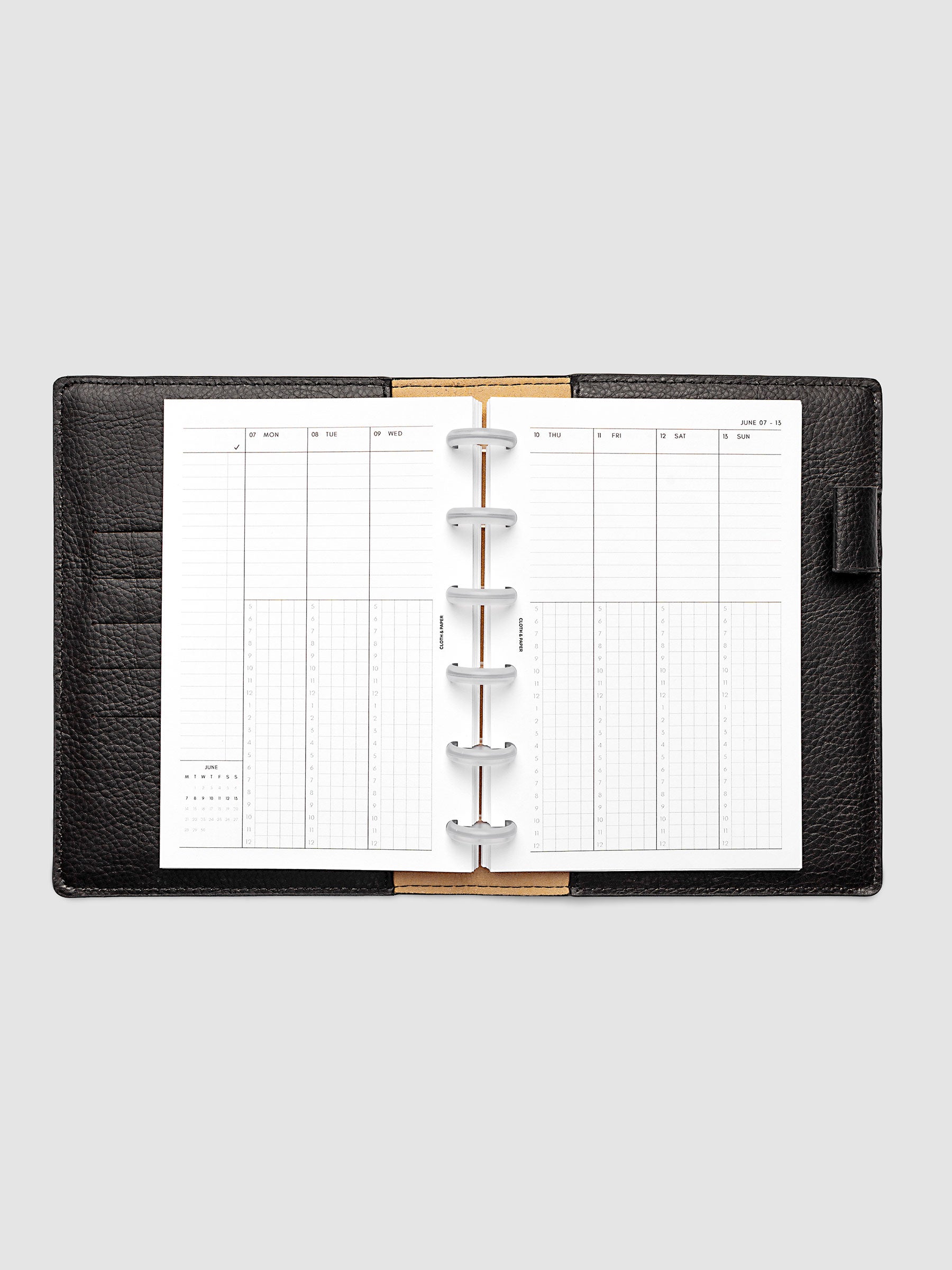 CP Petite 6-Disc Punch weekly time block spread showing left and right pages in a planner