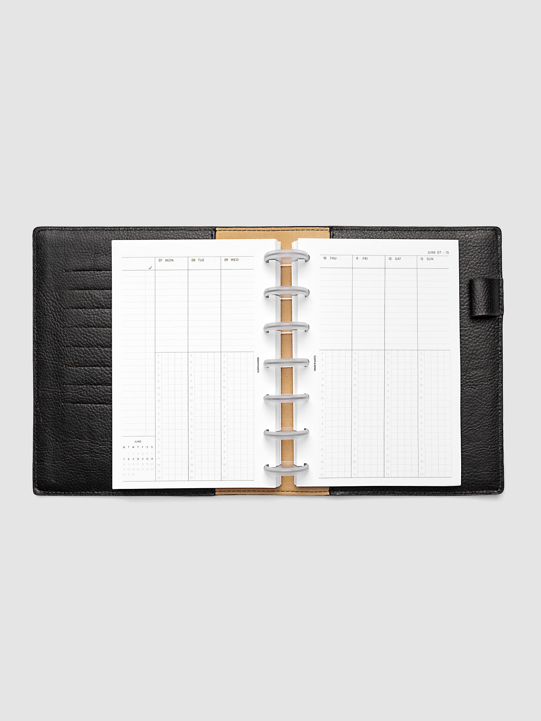 HP Mini 7-Disc Punch weekly time block spread showing left and right pages in a planner