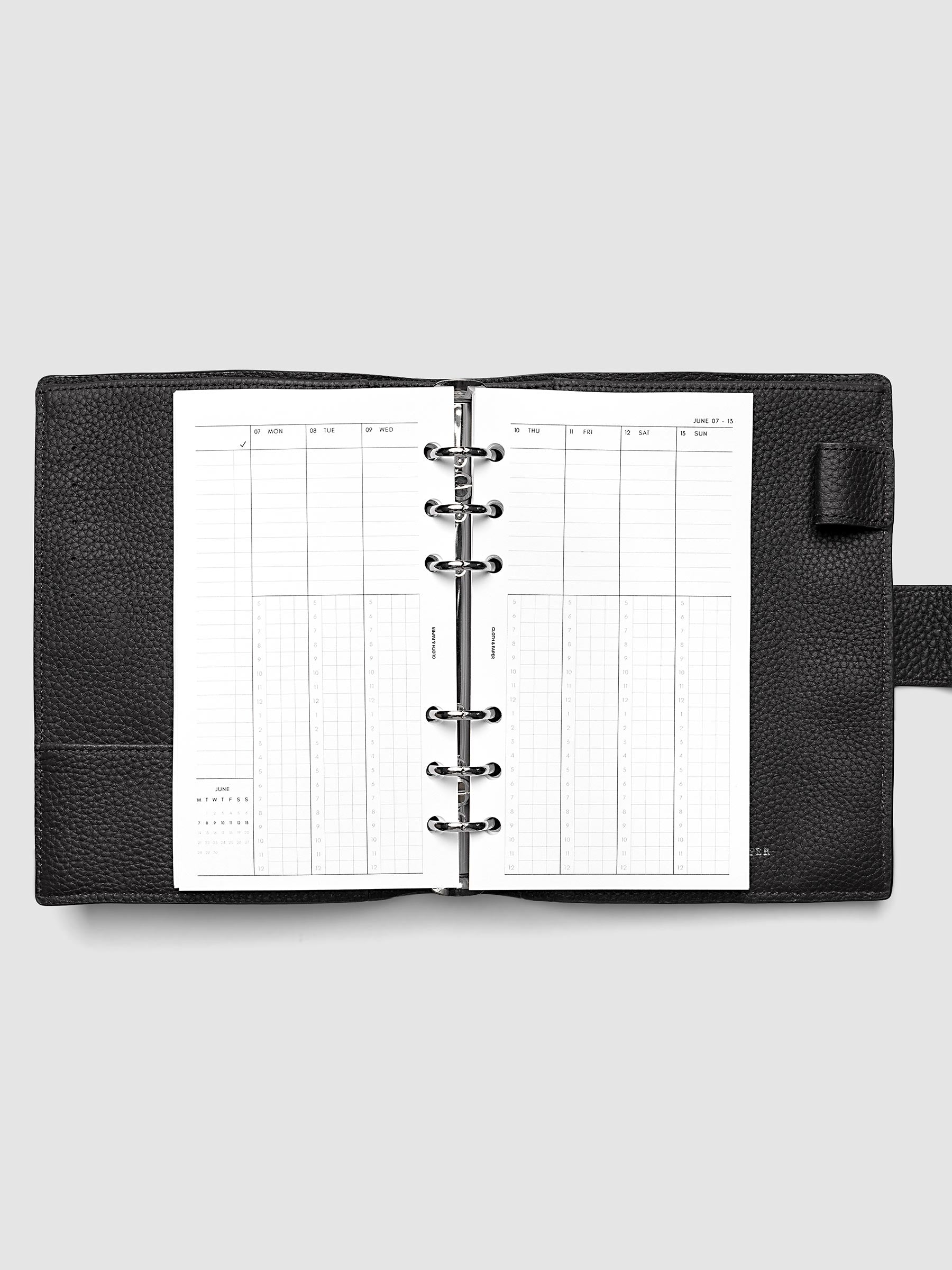 Personal 6-Ring Punch weekly time block spread showing left and right pages in a planner
