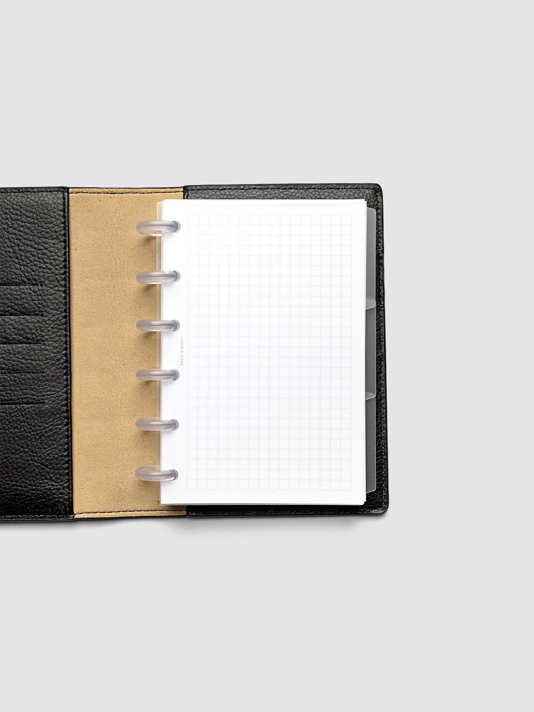 Blank, transparent side tab divider set shown in a CP Petite planner.