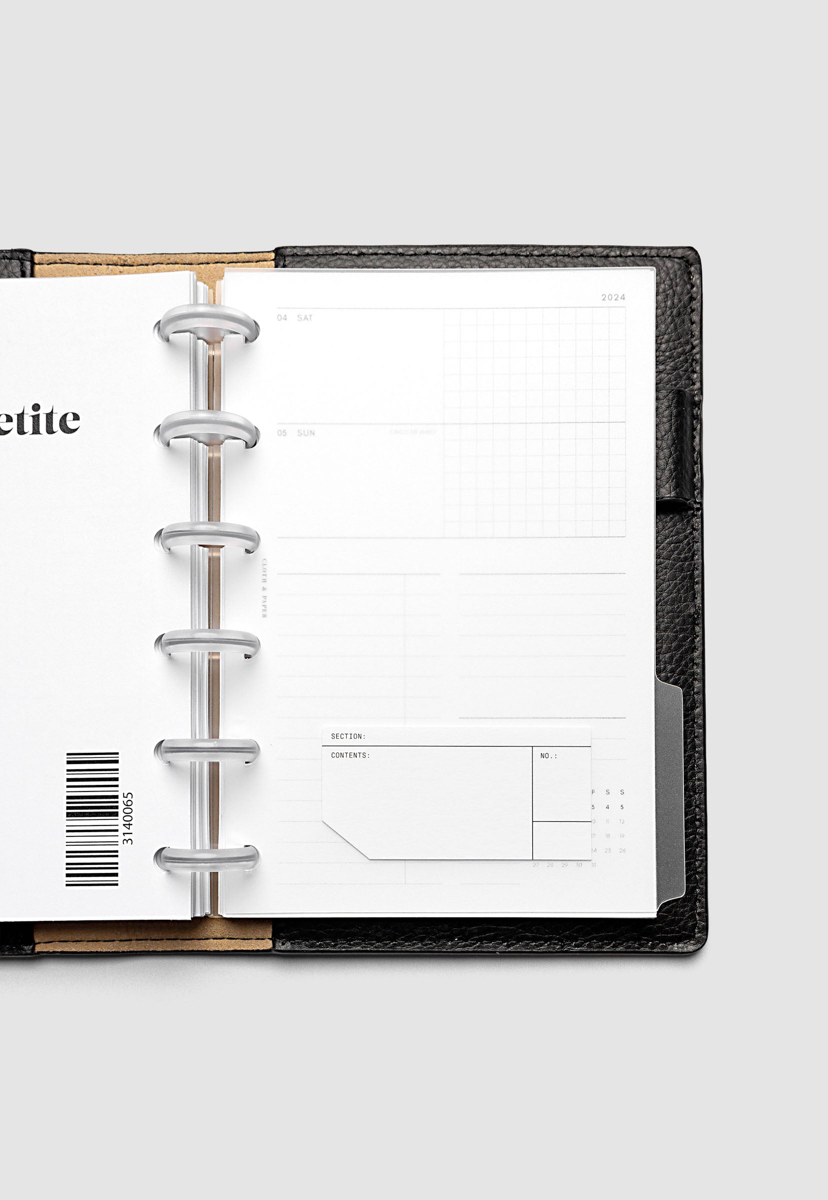 Clear side tab dividers sized for CP Petite planners shown in use with a blank label with headers section, content, and no.