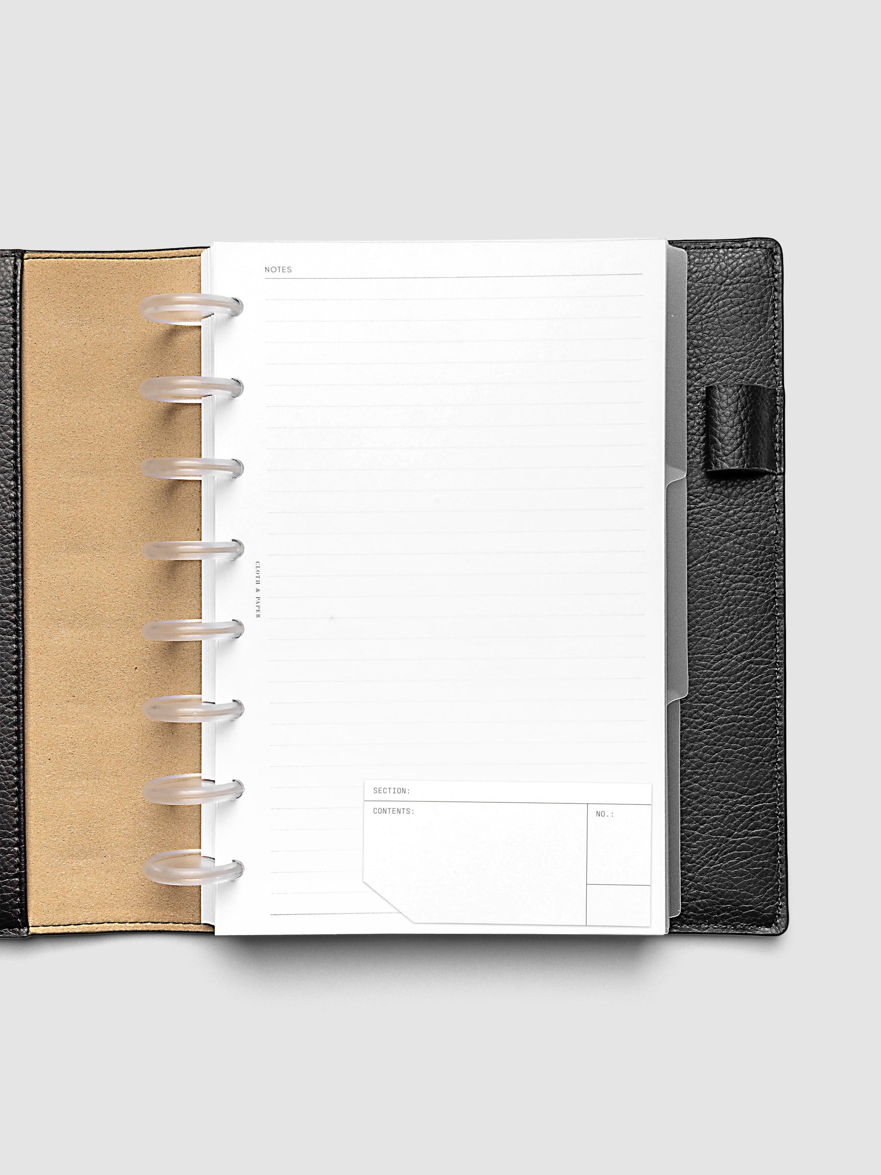 Clear side tab dividers sized for Half Letter planners shown in use with a blank label with headers section, content, and no.
