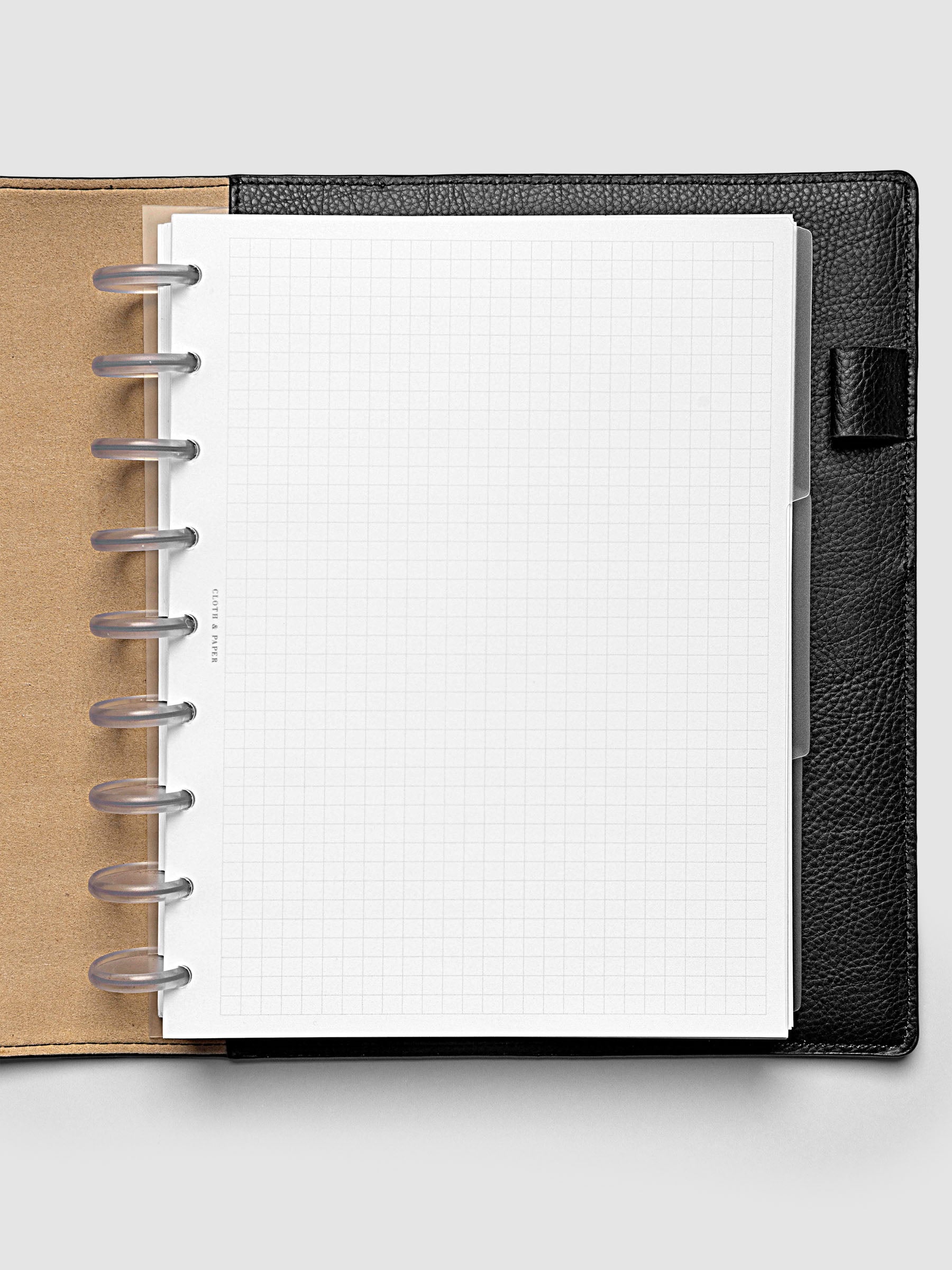 Blank, transparent side tab divider set shown in a HP Classic planner.