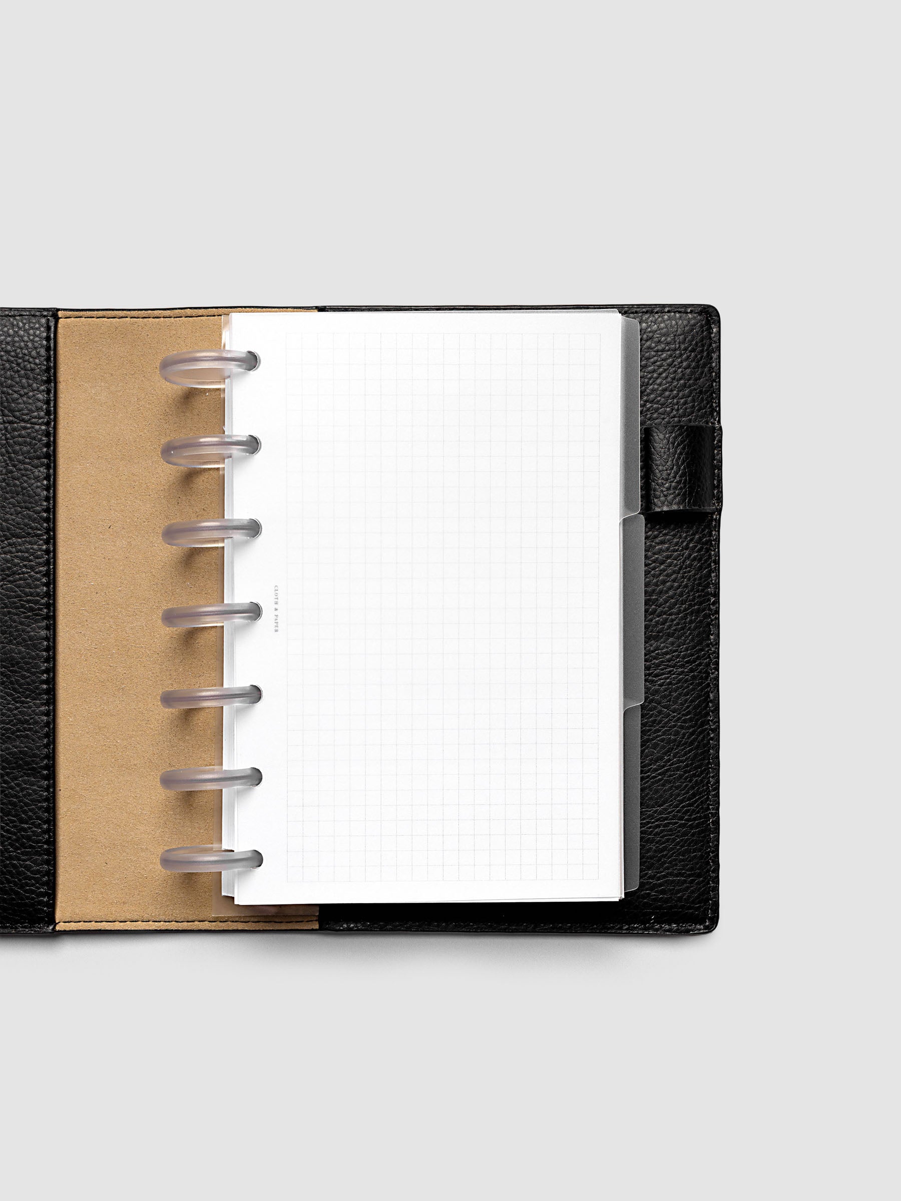 Blank, transparent side tab divider set shown in an HP Mini planner.