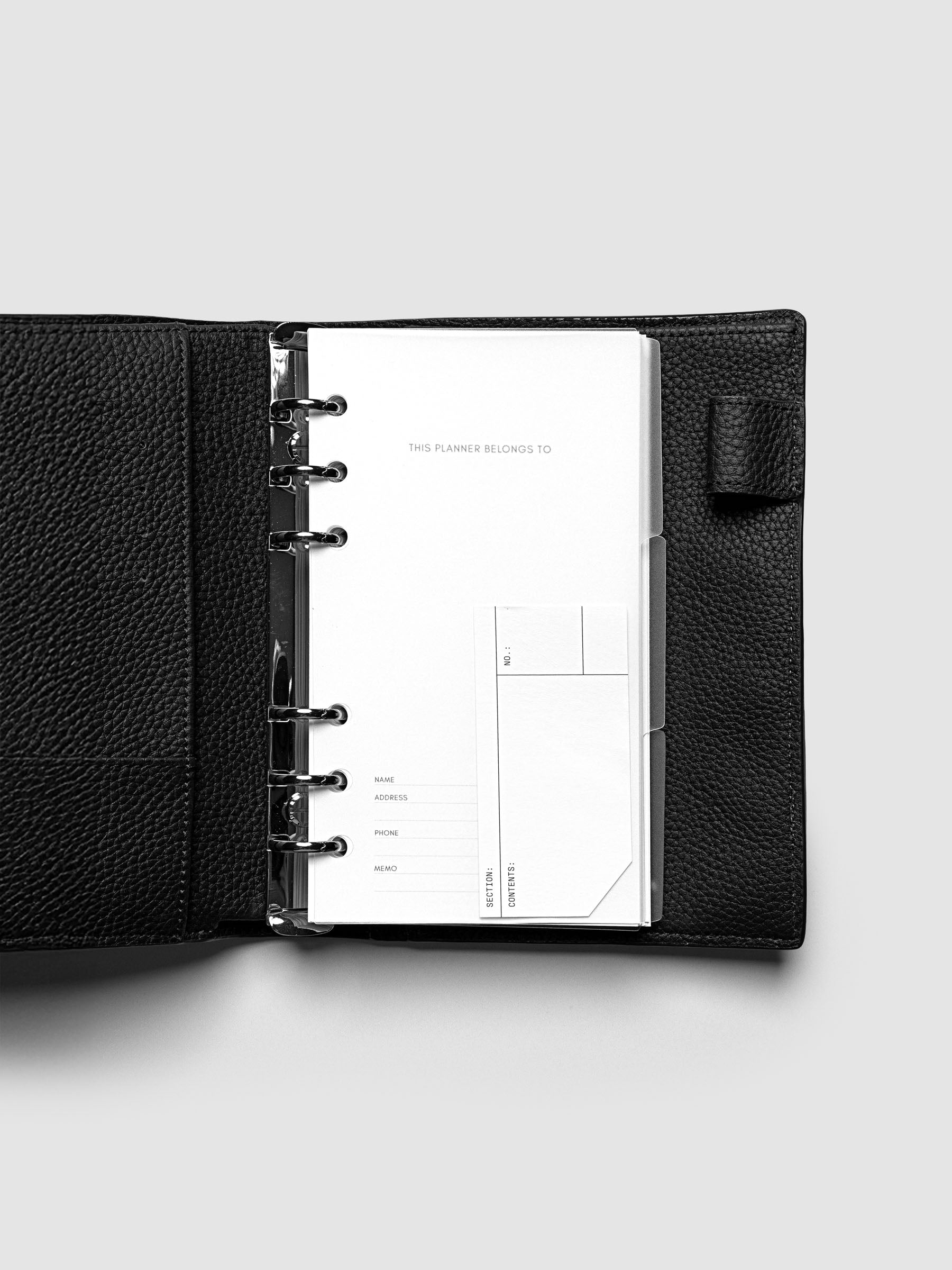 Clear side tab dividers sized for Personal planners shown in use with a blank label with headers section, content, and no.